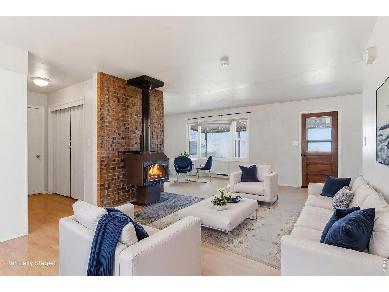 Image 4: Cozy up around your central wood burning stove (virtually staged)