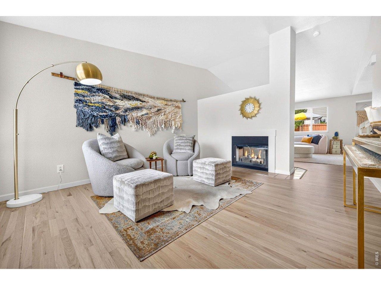 Image 2: Warm, inviting Entryway with Gas Fireplace