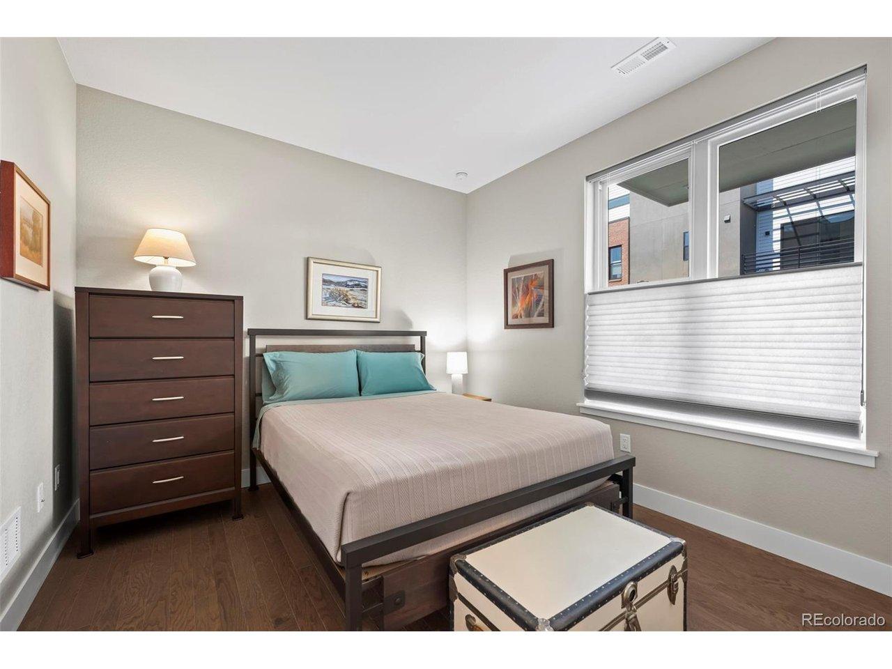 Image 4: 1st floor bedroom with ensuite bath is the perfect guest suite, home office or workout space Image 4: 1st floor bedroom with ensuite bath is the perfect guest suite, home office or workout space