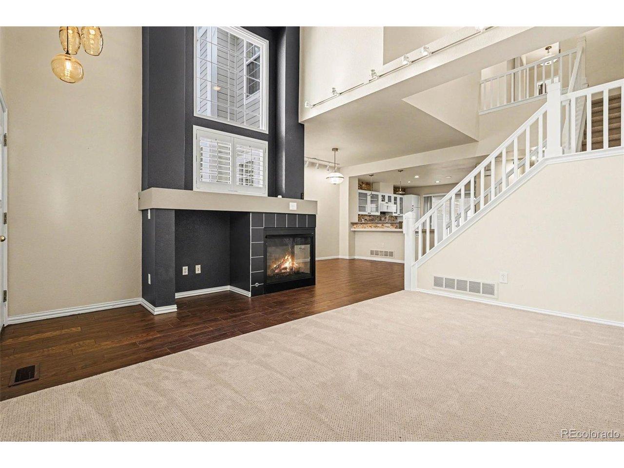 Image 4: Living room looking toward fireplace and dining room Image 4: Living room looking toward fireplace and dining room