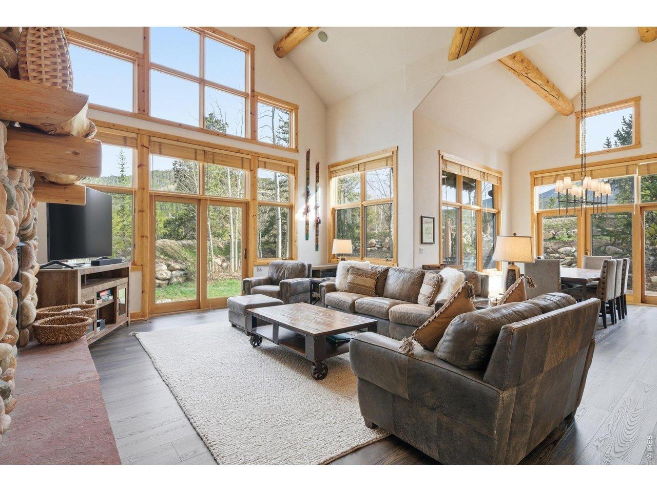 Image 3: Mountain view and beautiful sunlight flooding the great room
