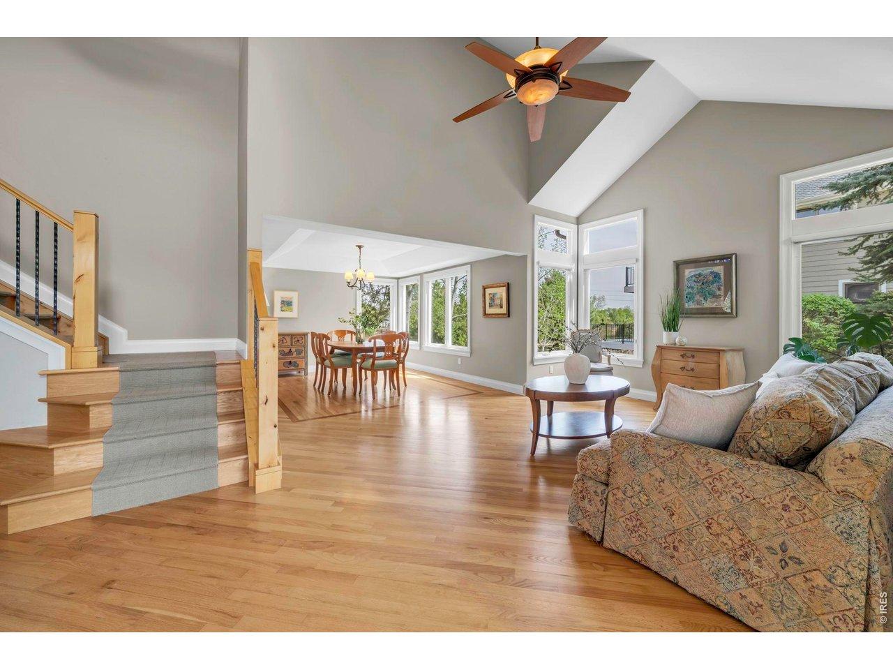 Image 3: Hardwood floors throughout living and dining rooms