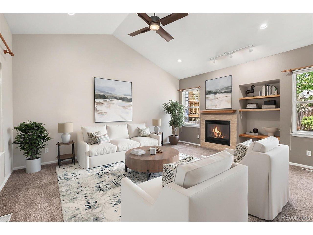 Image 3: Bright and open family room with vaulted ceilings and gas burning fireplace (Virtually staged)