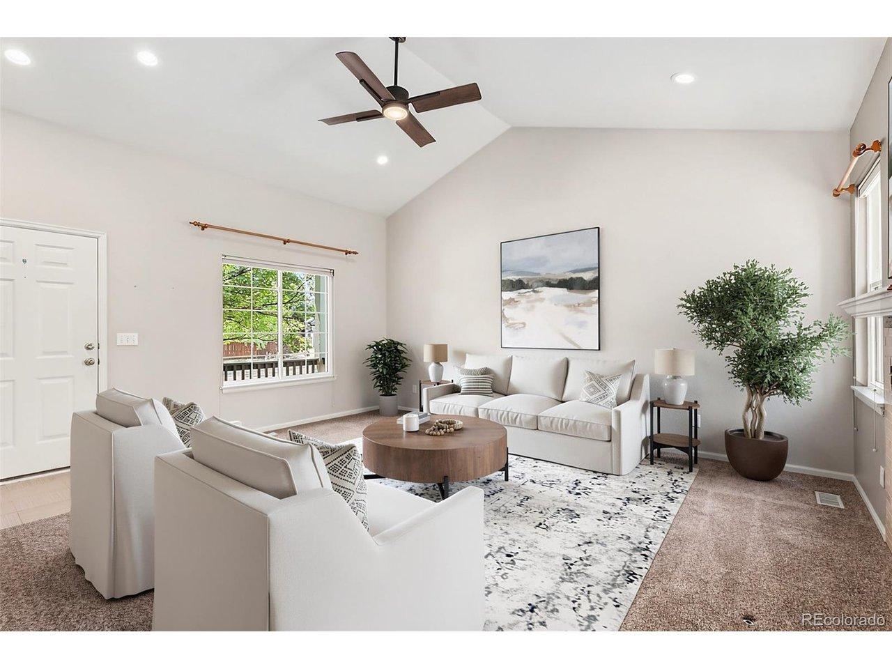 Image 4: Bright and open family room with vaulted ceilings and gas burning fireplace  (Virtually staged)