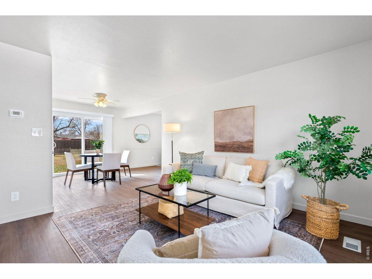 Image 4: Bright and spacious living room with large windows and modern flooring. Image 4: Bright and spacious living room with large windows and modern flooring.