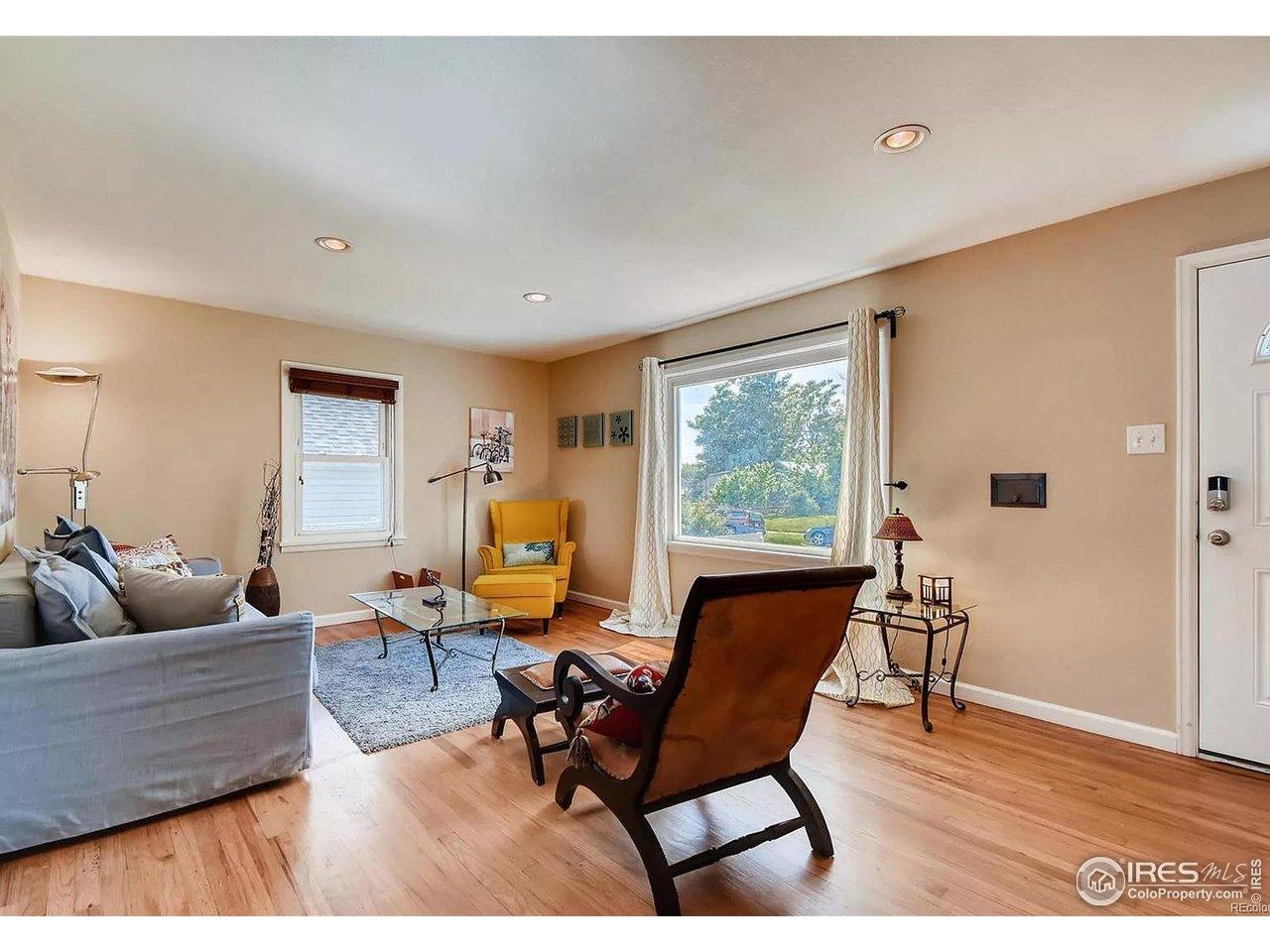Image 4: Wood floors and sunshine in the open living room