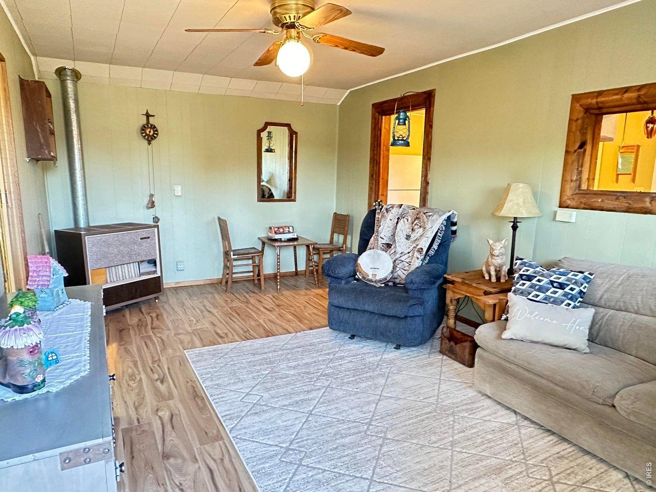 Image 1: Welcoming front room with new flooring and paint includes a queen sofa bed. This cabin sleep 6 and there is room for your RV (w/electric) out front for more guests. Image 1: Welcoming front room with new flooring and paint includes a queen sofa bed. This cabin sleep 6 and there is room for your RV (w/electric) out front for more guests.