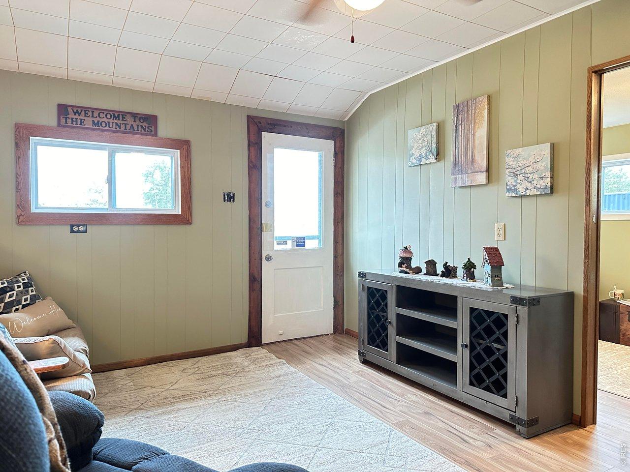 Image 2: Living Room is full of Light leads to the Front Deck Image 2: Living Room is full of Light leads to the Front Deck