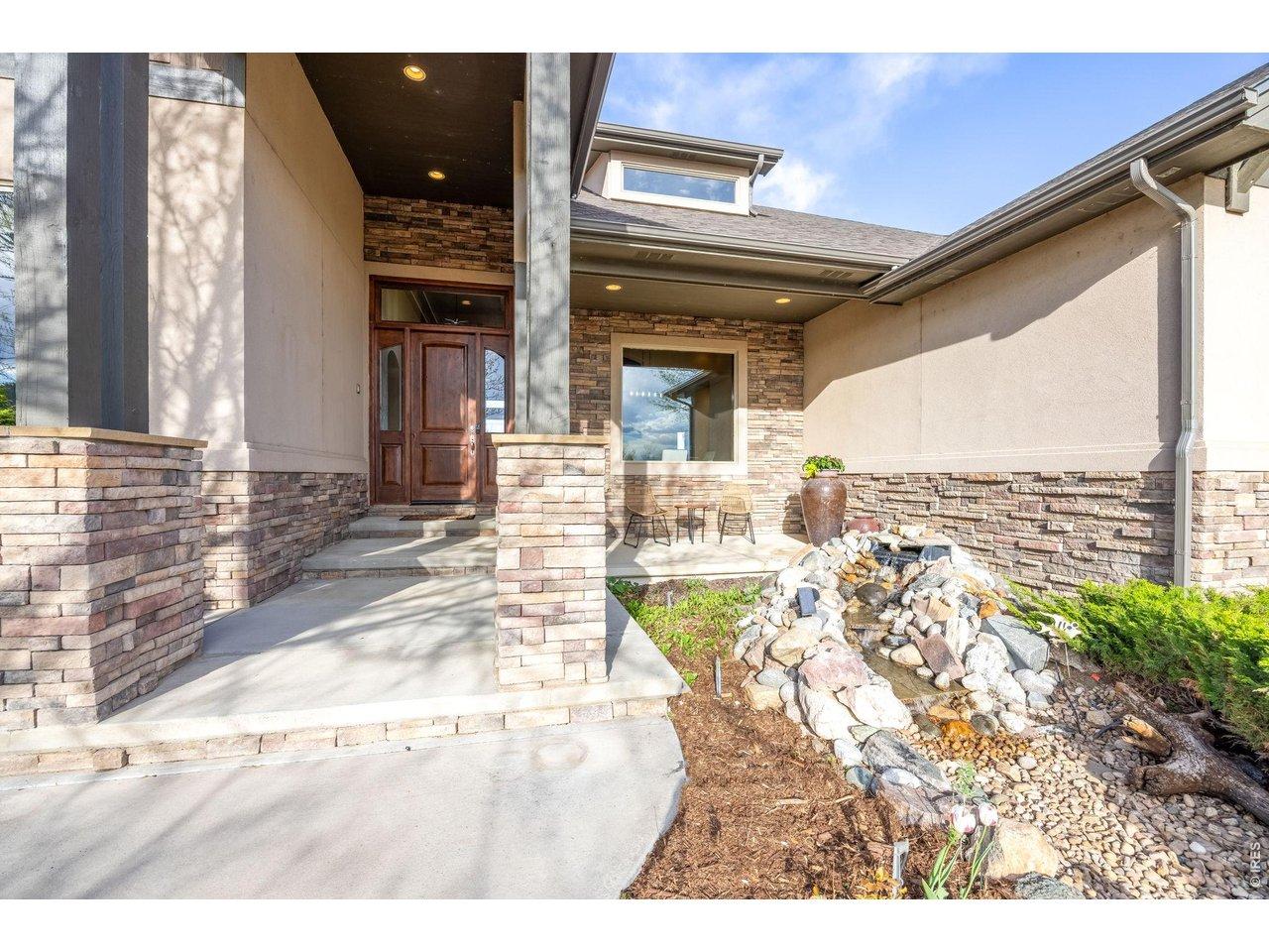 Image 4: Covered front porch with peaceful water feature