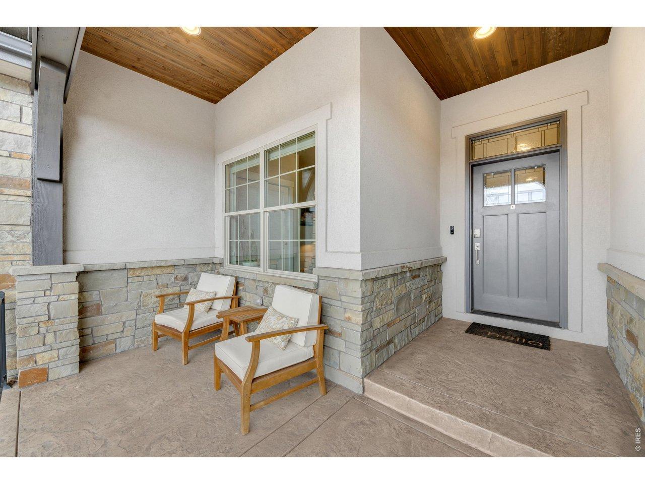 Image 3: Front Entry: Elegant front entryway with stone detailing