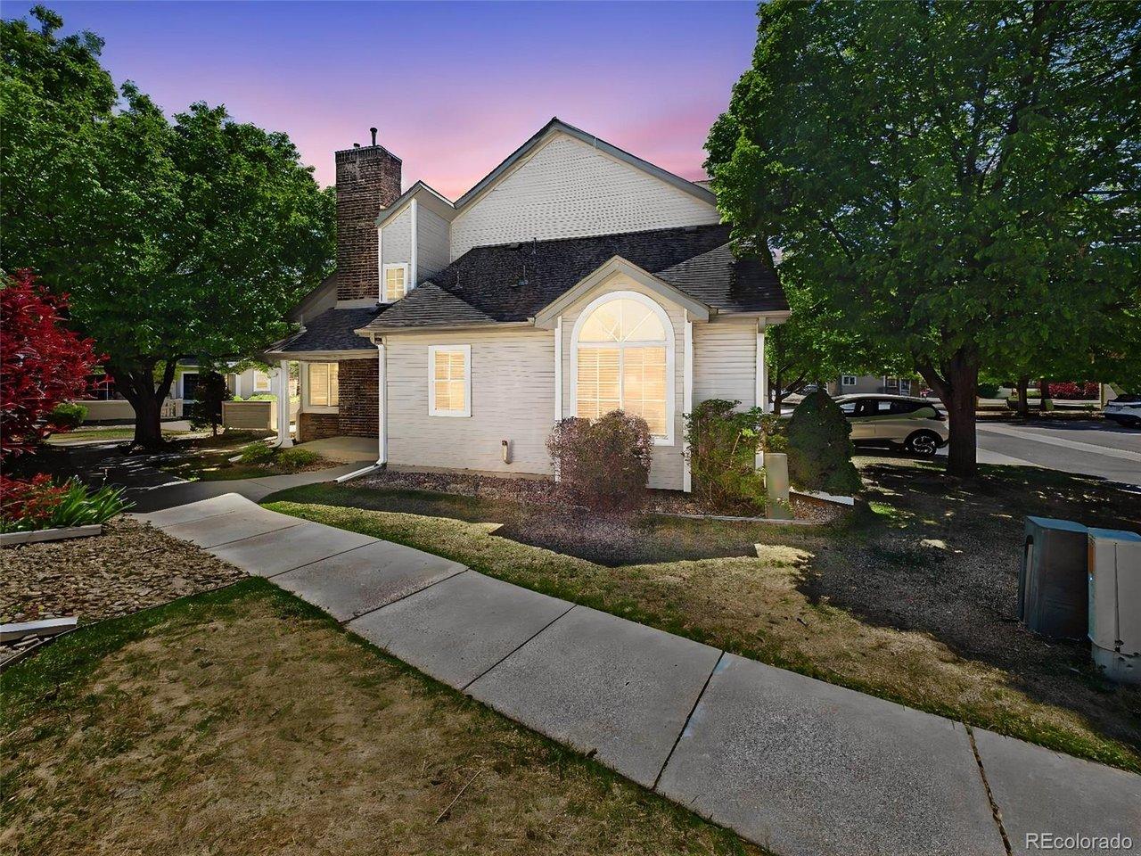 Image 1: Exterior Front - End-unit location with mature trees and landscaped surroundings, offering added privacy and curb appeal within the community. Image 1: Exterior Front - End-unit location with mature trees and landscaped surroundings, offering added privacy and curb appeal within the community.