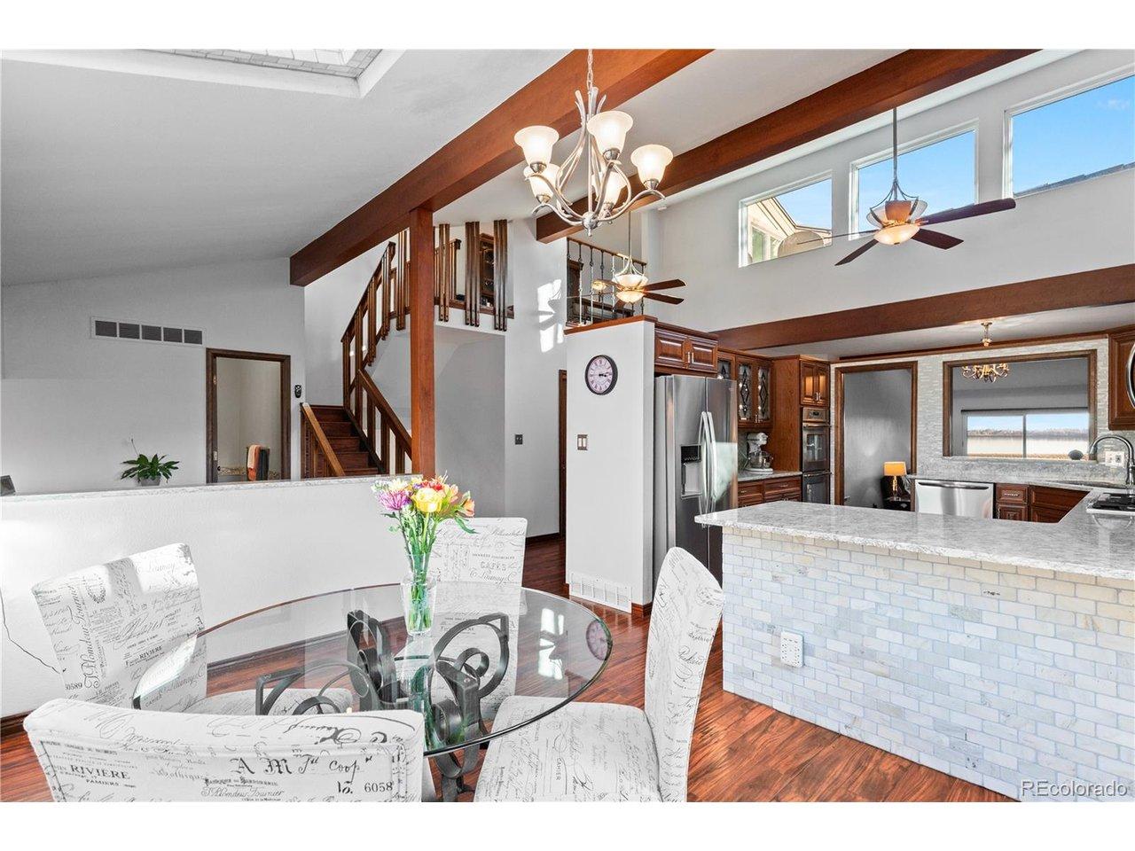 Image 2: Main-level breakfast nook and dining area Main-level breakfast nook and dining area with vaulted ceilings and abundant natural light. Image 2: Main-level breakfast nook and dining area Main-level breakfast nook and dining area with vaulted ceilings and abundant natural light.