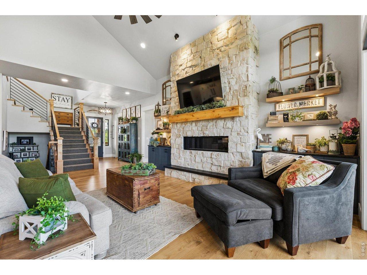 Image 4: Custom stone fireplace with built-in's on each side.