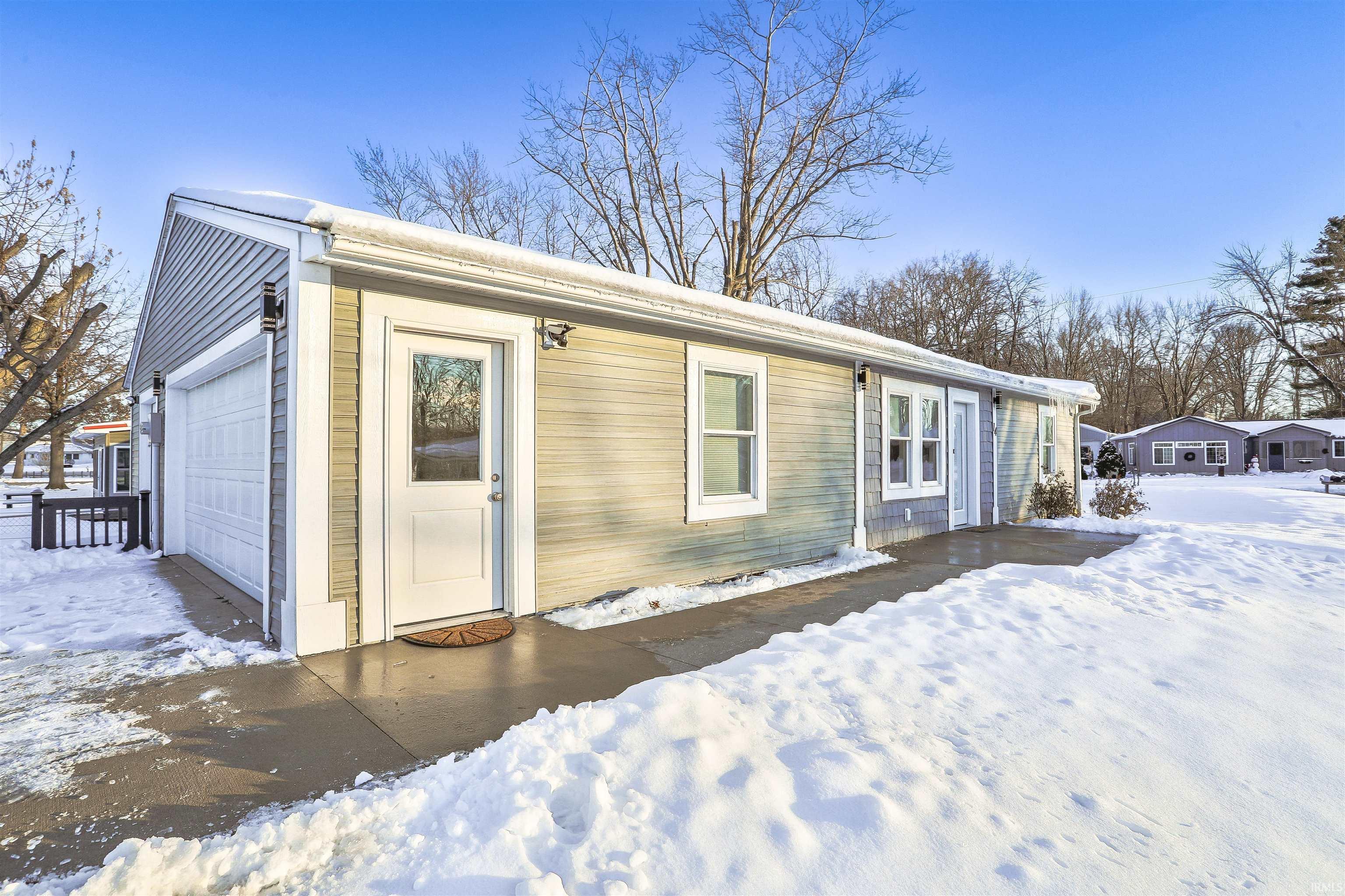 Image 2: View of front of house featuring a garage, Front Of Structure Image 2: View of front of house featuring a garage, Front Of Structure