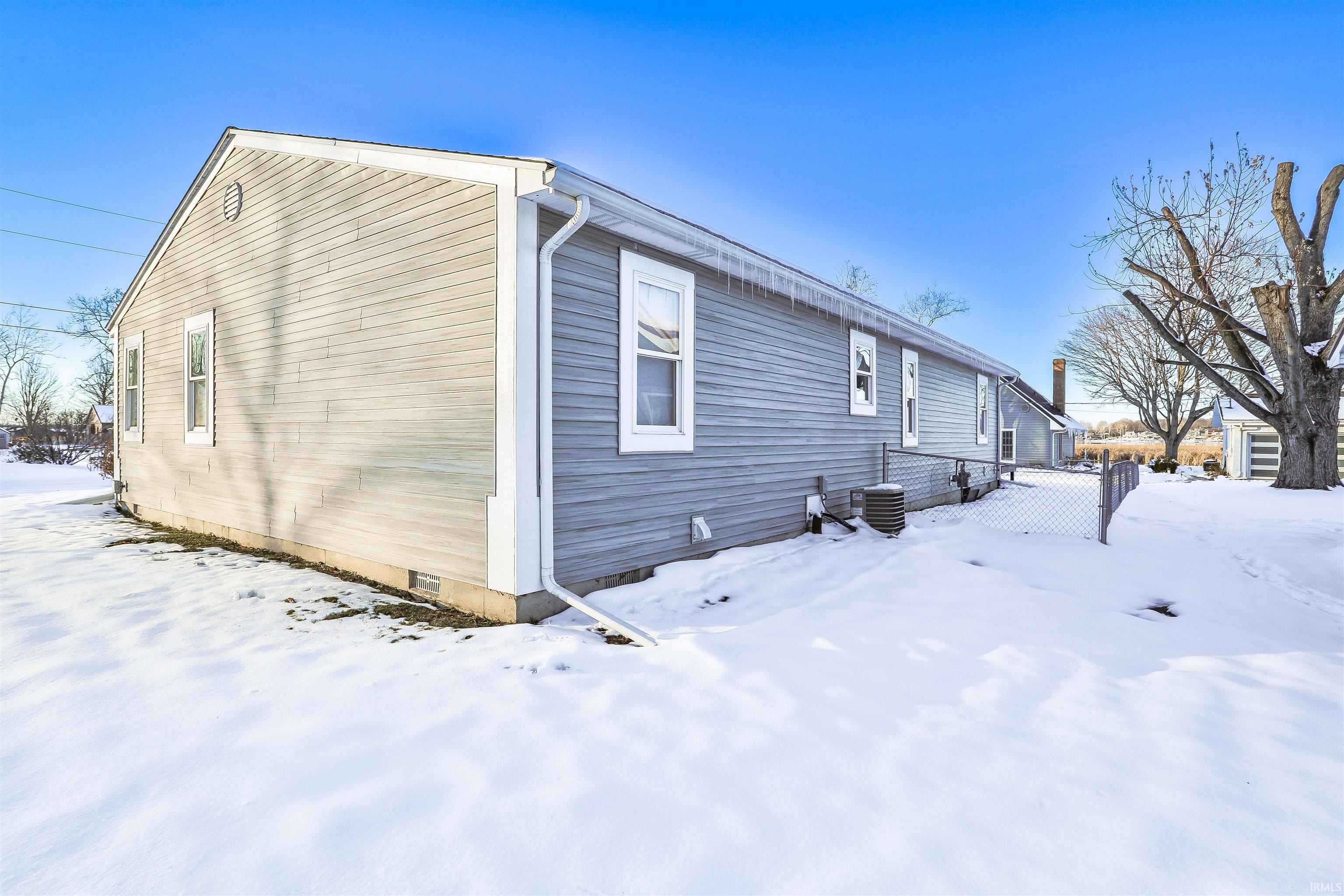 Image 3: View of snow covered exterior with crawl space, Side Of Structure Image 3: View of snow covered exterior with crawl space, Side Of Structure