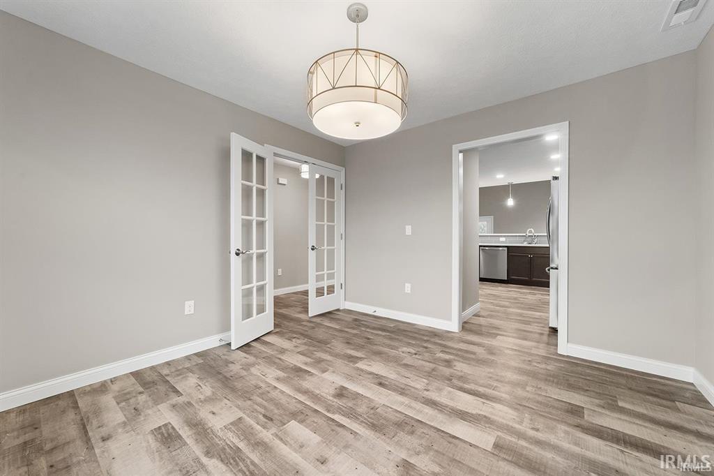 Image 3: Unfurnished room with french doors and light wood-type flooring, Other Image 3: Unfurnished room with french doors and light wood-type flooring, Other