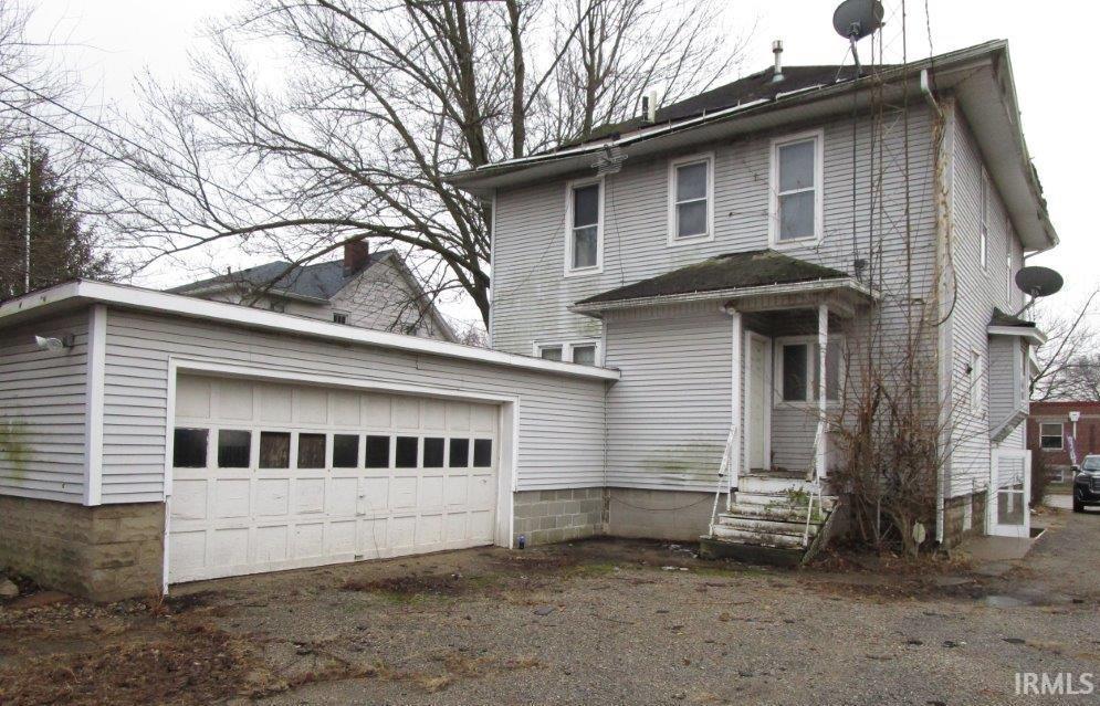 Image 1: American foursquare style home with a garage, Front Of Structure