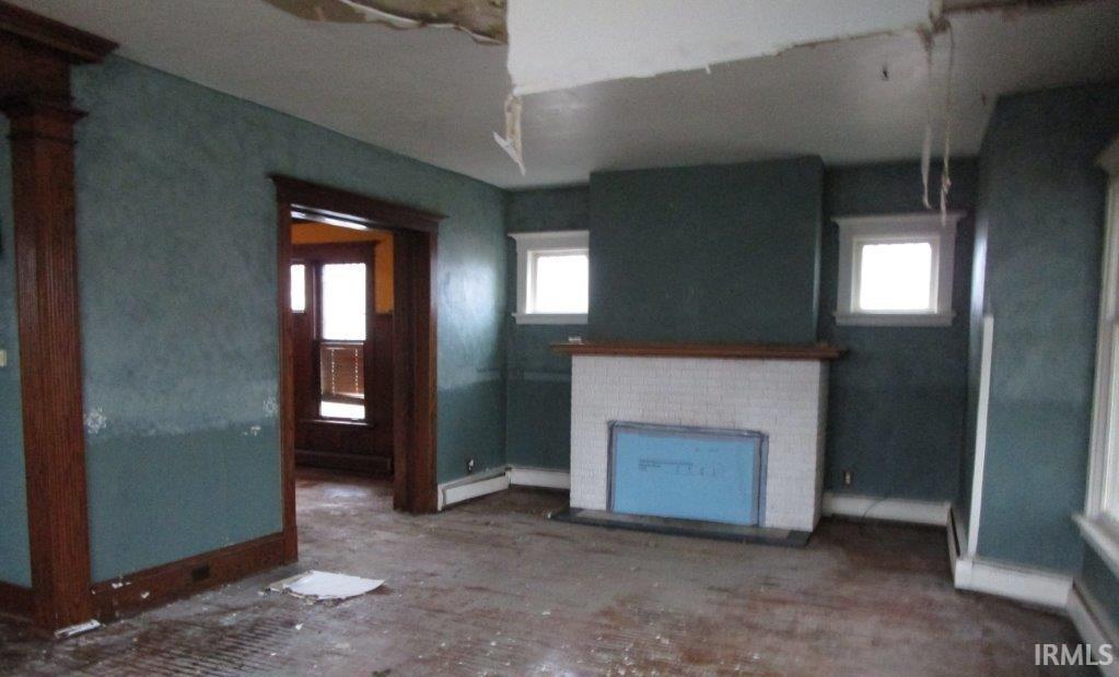 Image 3: Unfurnished living room featuring a fireplace, Living Room