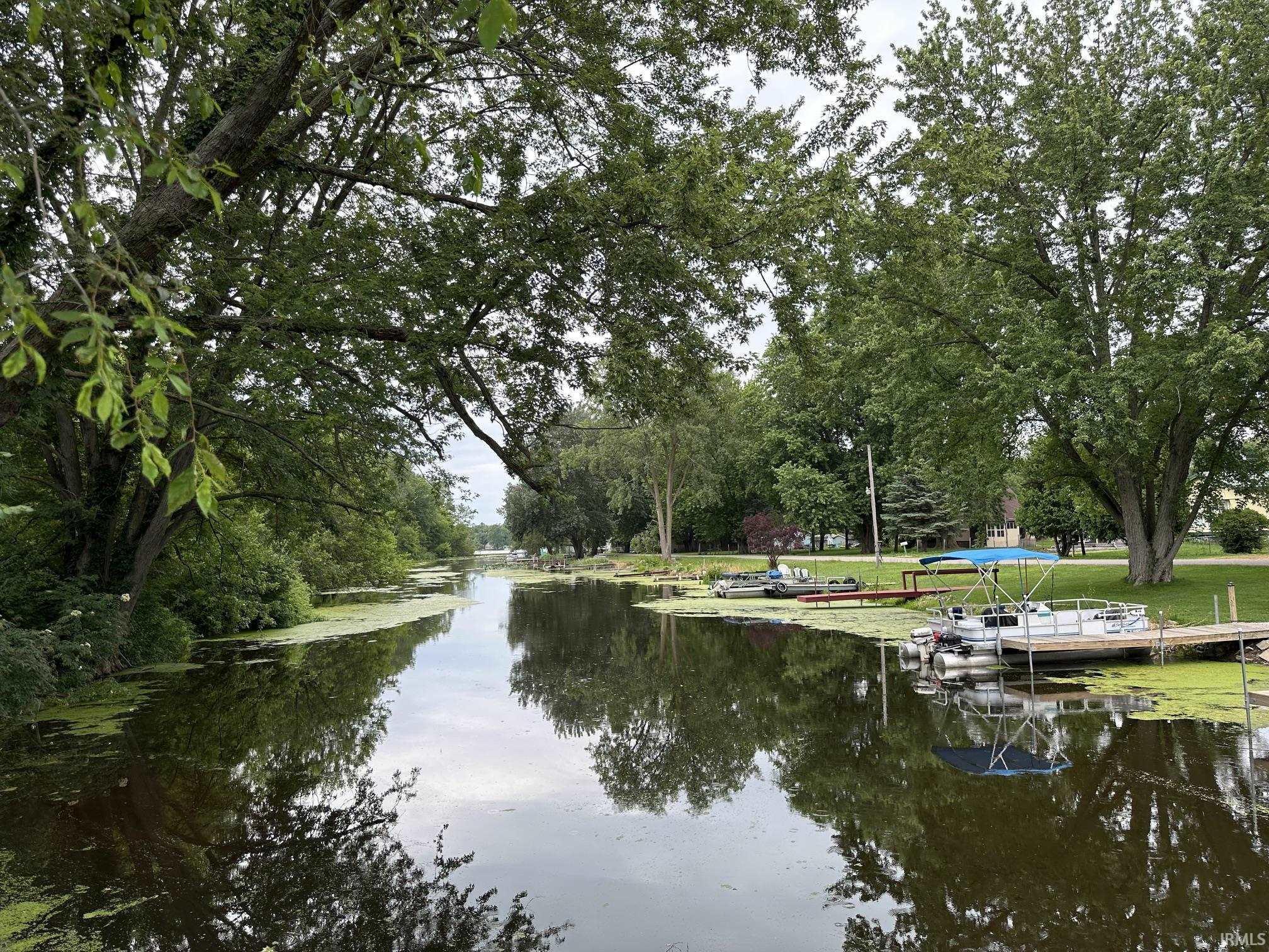 Image 2: Sale includes 25' x 22' lot with pier on channel right around the corner, Channel Lot