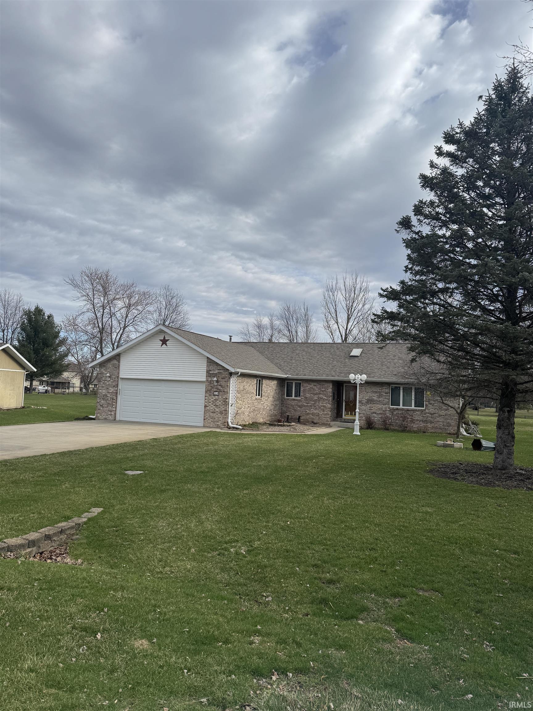 Image 2: Ranch-style home featuring a garage, a front lawn, concrete driveway, and brick siding, Front Of Structure Image 2: Ranch-style home featuring a garage, a front lawn, concrete driveway, and brick siding, Front Of Structure