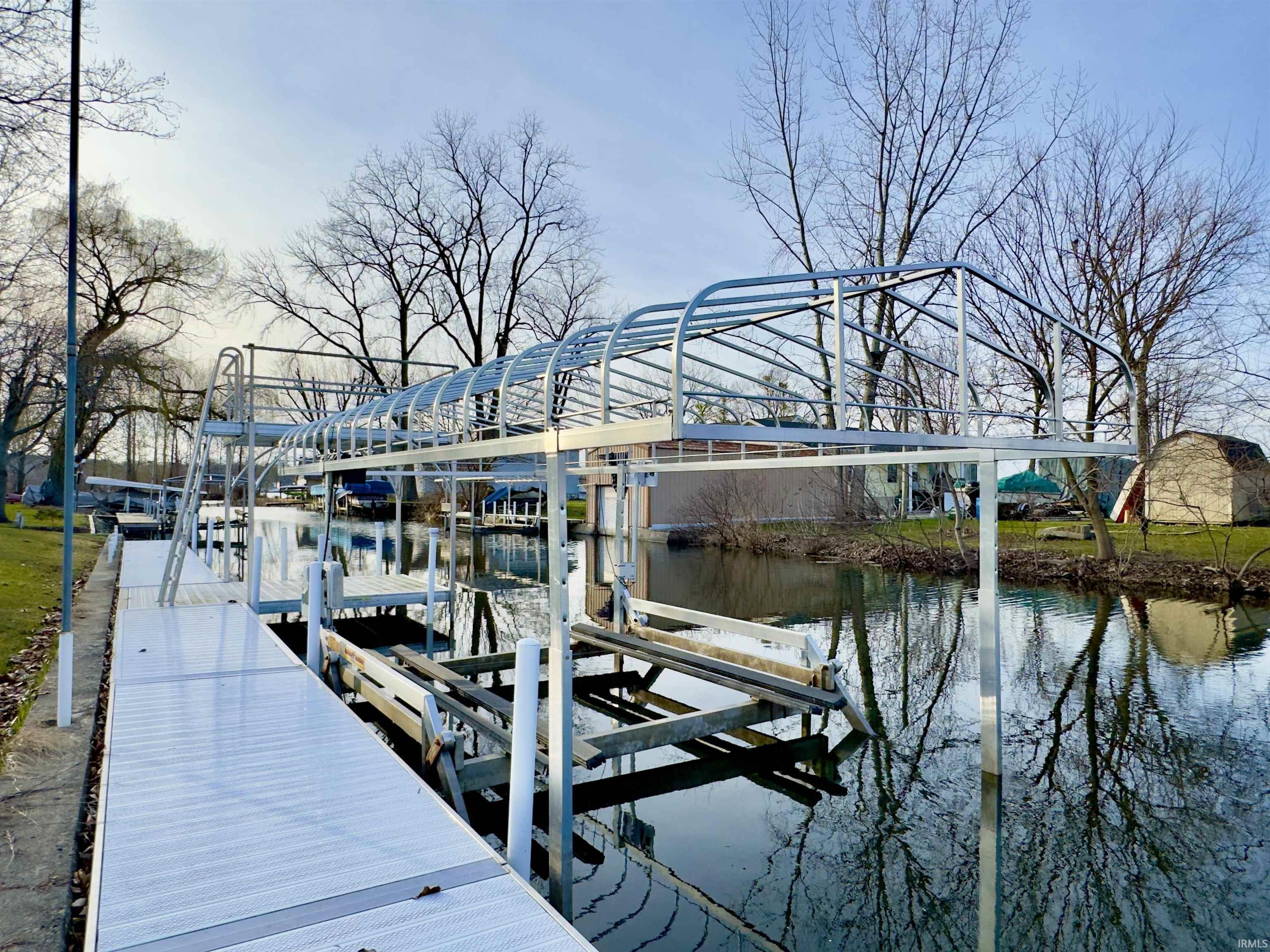 Image 3: Dock with boat lift and a water view, Dock