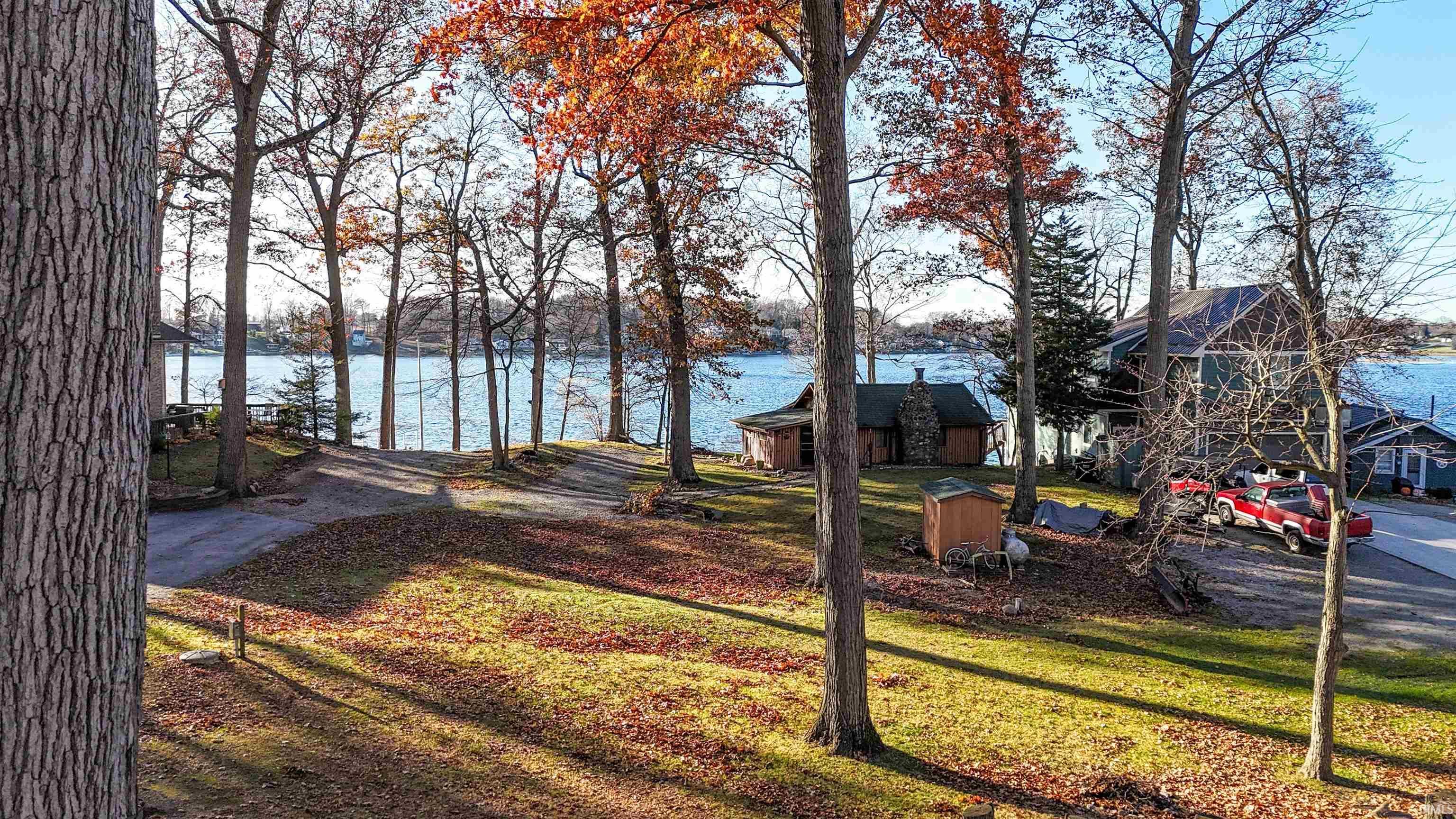 Image 0: View of grassy yard featuring a water view, Yard