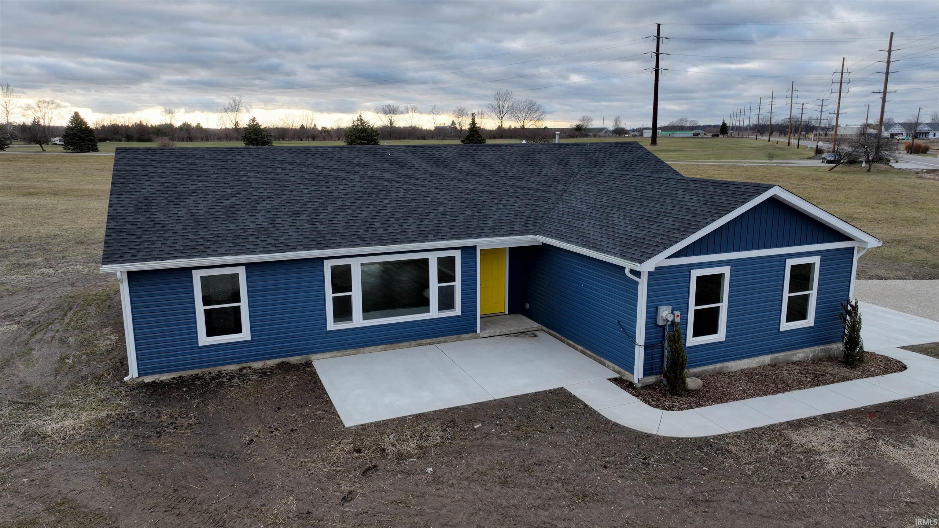 Image 0: Ranch-style home featuring a shingled roof, Front Of Structure
