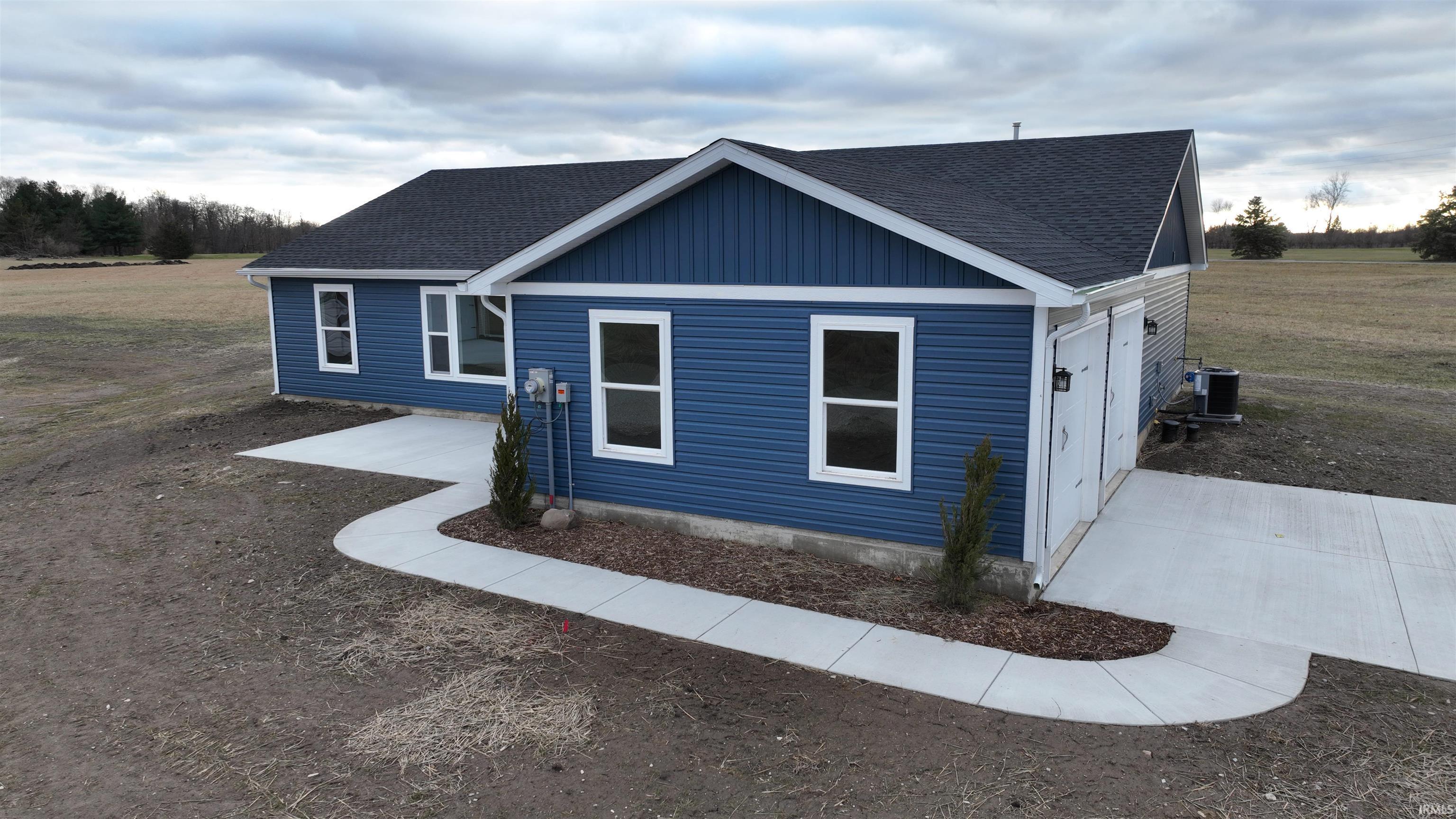Image 3: View of home's exterior with roof with shingles, Side Of Structure