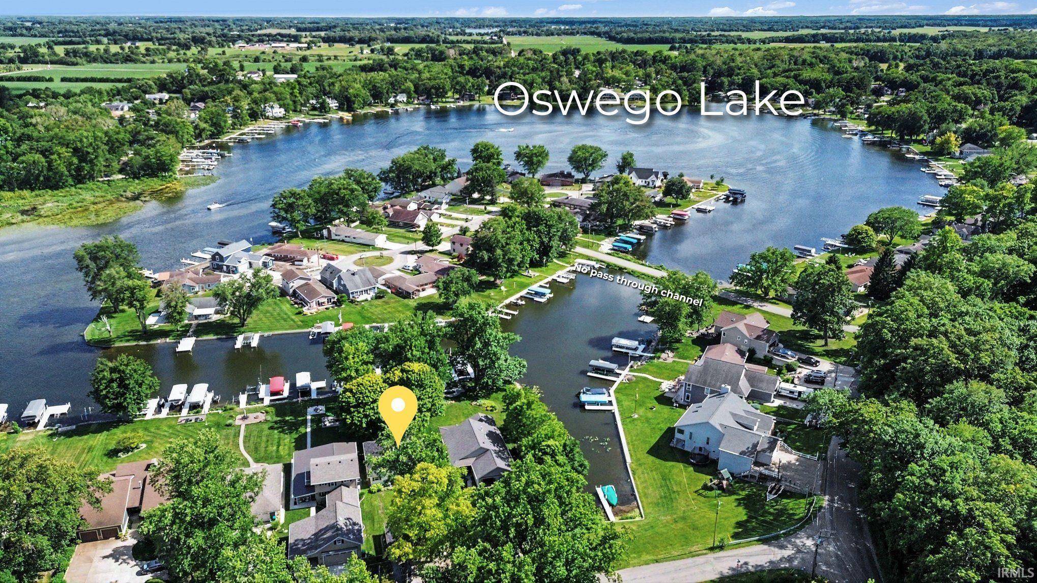 Image 3: This is not a pass through channel, which means your spot on the lake is low traffic and peaceful, while still being a stone's throw from the main body of the lake., Perfectly Situated in an Alcove between Tippecanoe & Oswego Lakes Image 3: This is not a pass through channel, which means your spot on the lake is low traffic and peaceful, while still being a stone's throw from the main body of the lake., Perfectly Situated in an Alcove between Tippecanoe & Oswego Lakes