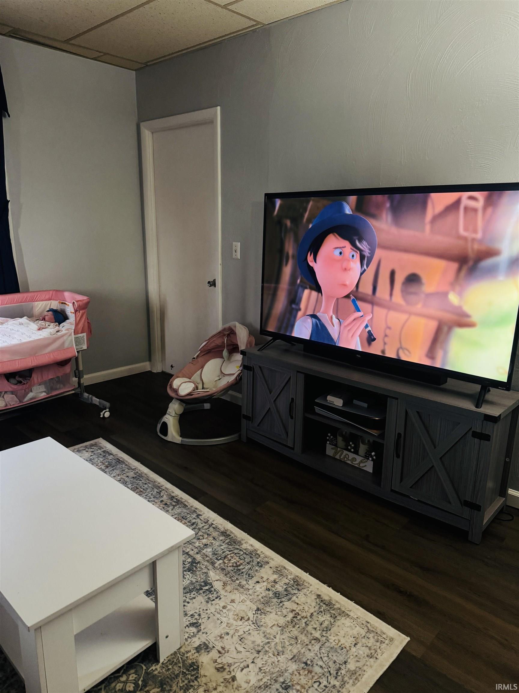 Image 3: Cinema featuring a drop ceiling and dark wood-type flooring, Media Room