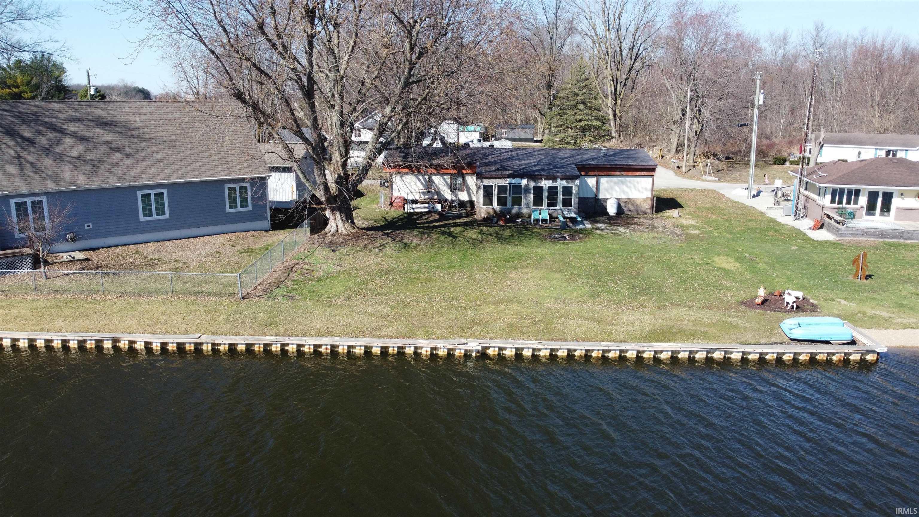 Image 0: Back of property with a yard and a water view, Back Of Structure