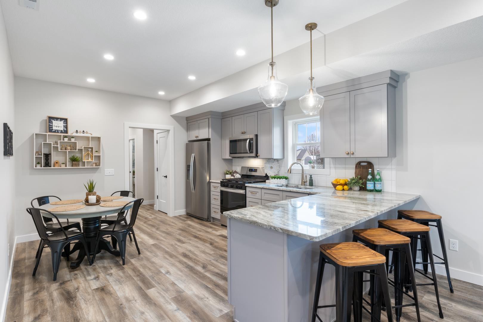 Image 2: Dining Area and Kitchen