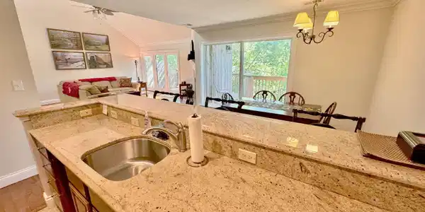 Image 3: Kitchen island with a stainless steel sink and a stainless steel faucet, granite countertops, and tile flooring, Kitchen Image 3: Kitchen island with a stainless steel sink and a stainless steel faucet, granite countertops, and tile flooring, Kitchen