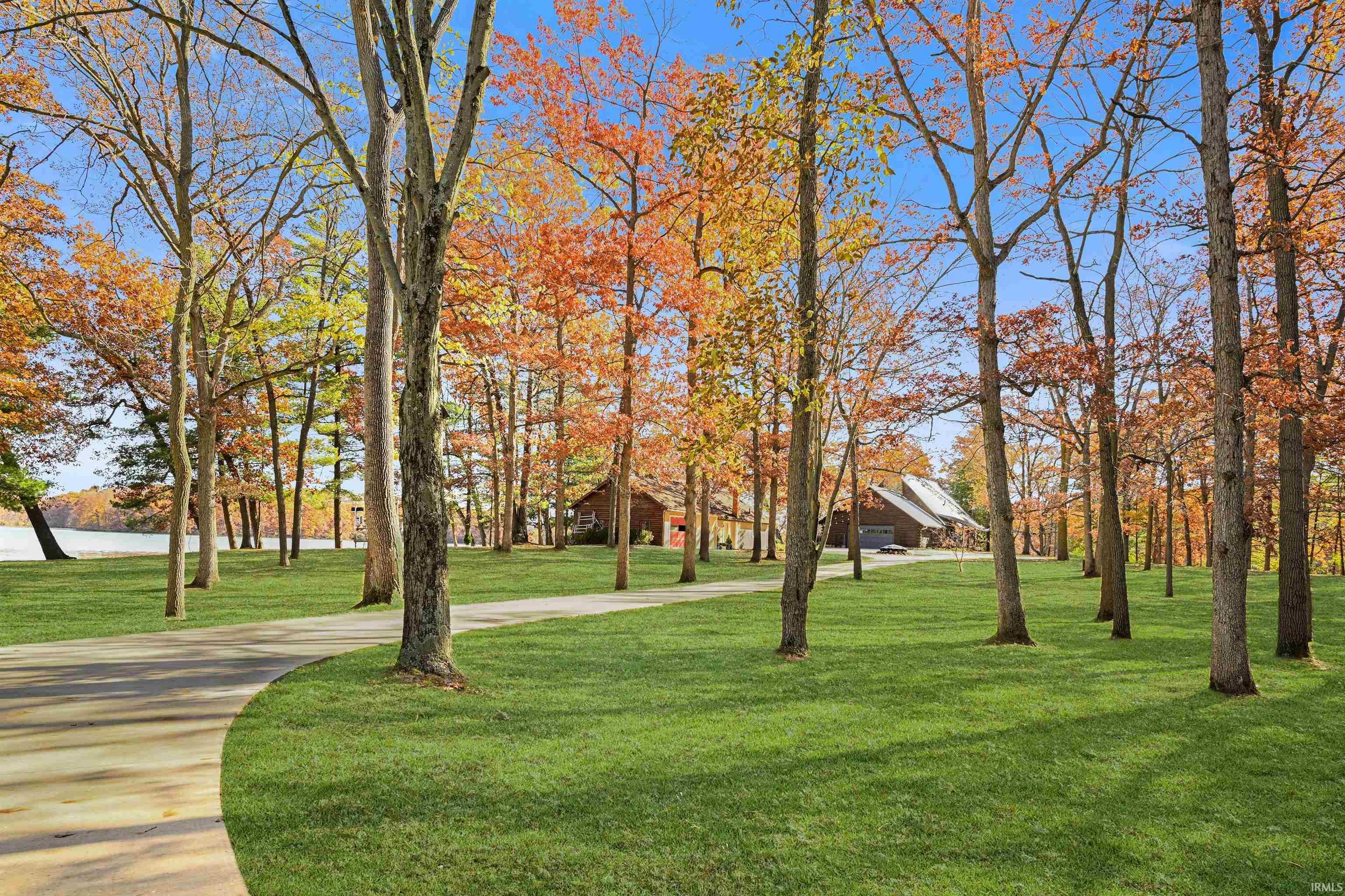 Image 2: View of community with a yard and a water view, Community