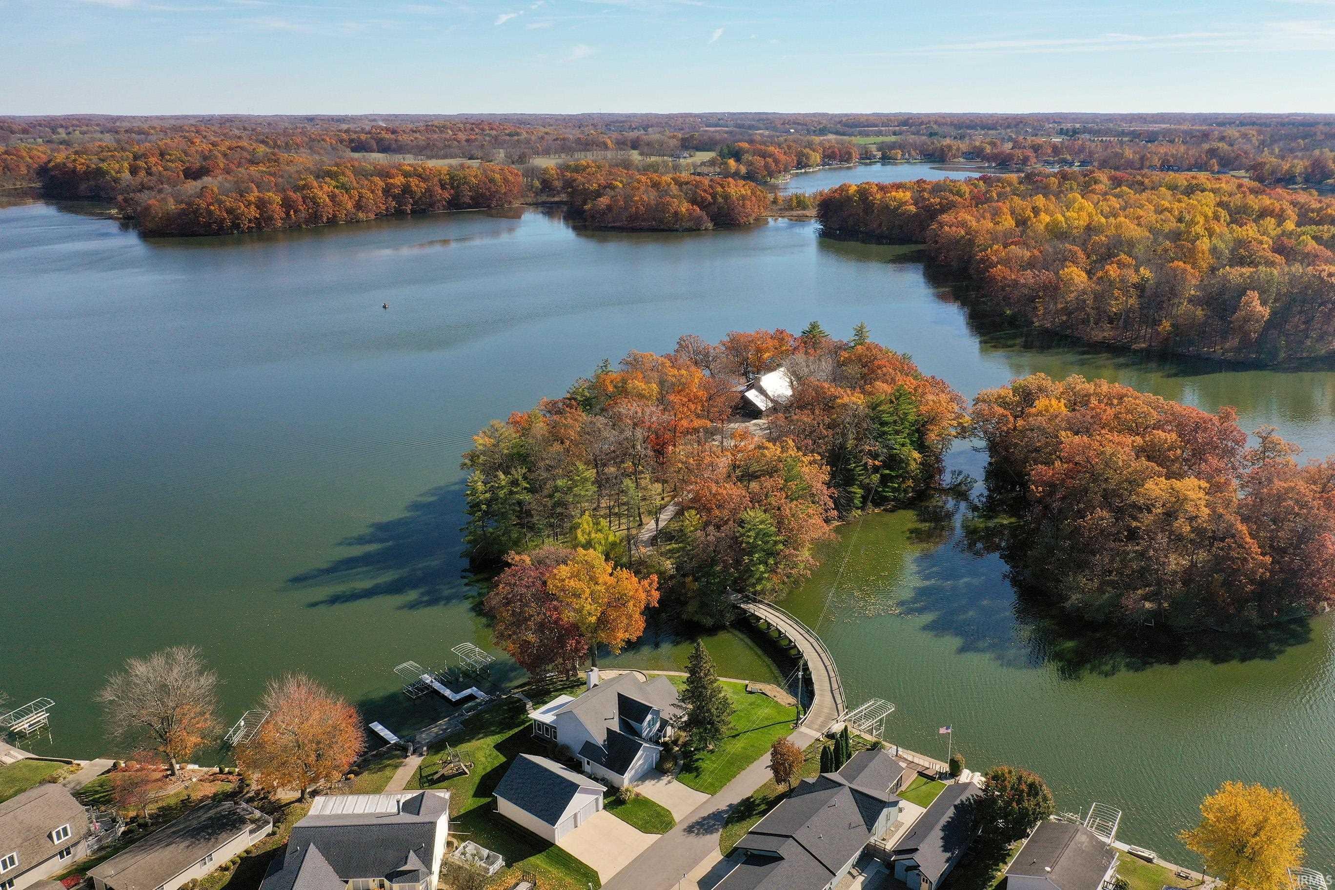 Image 3: View of property location with a forest and a large body of water, Aerial View