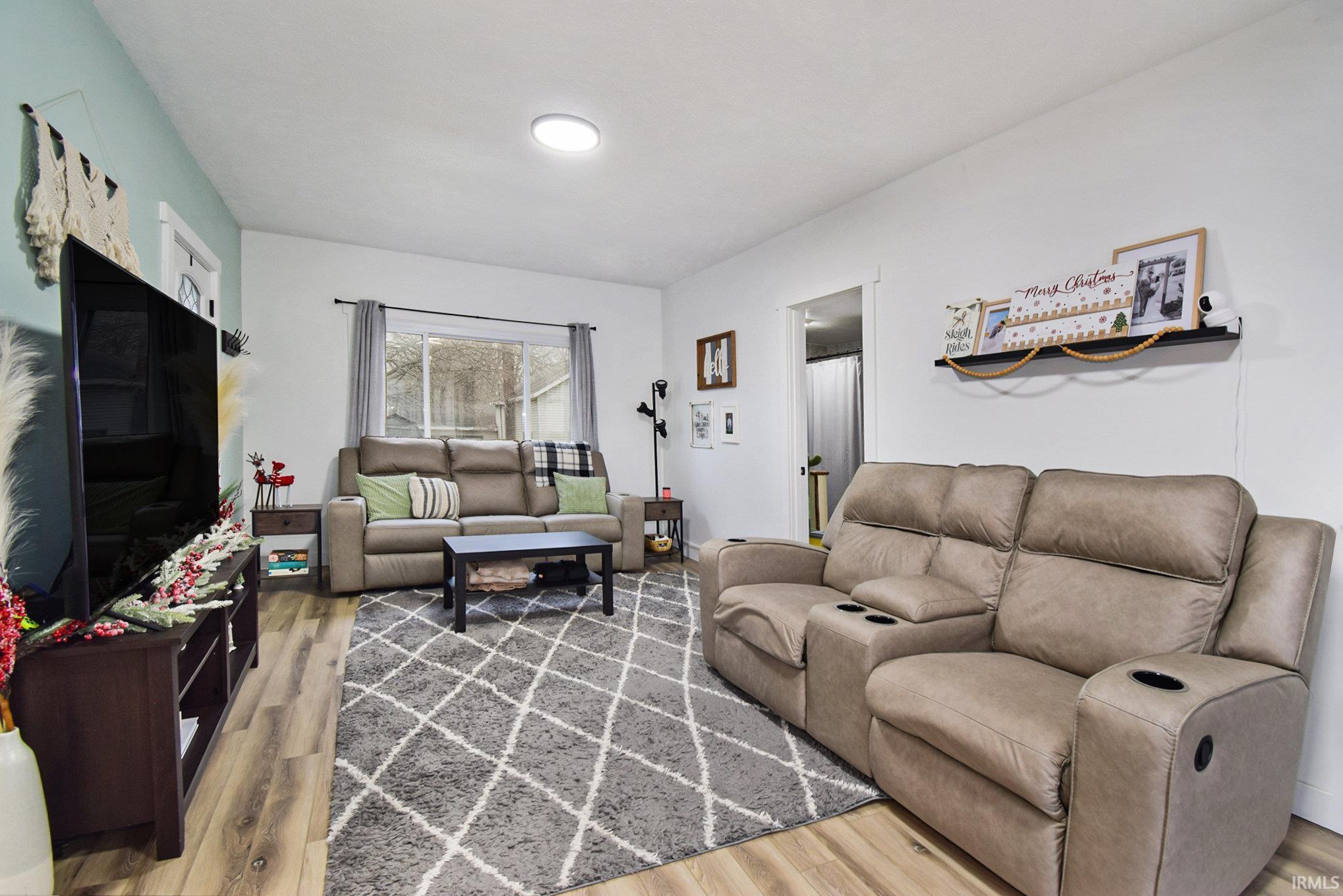 Image 2: Living room featuring light wood-style flooring, Living Room