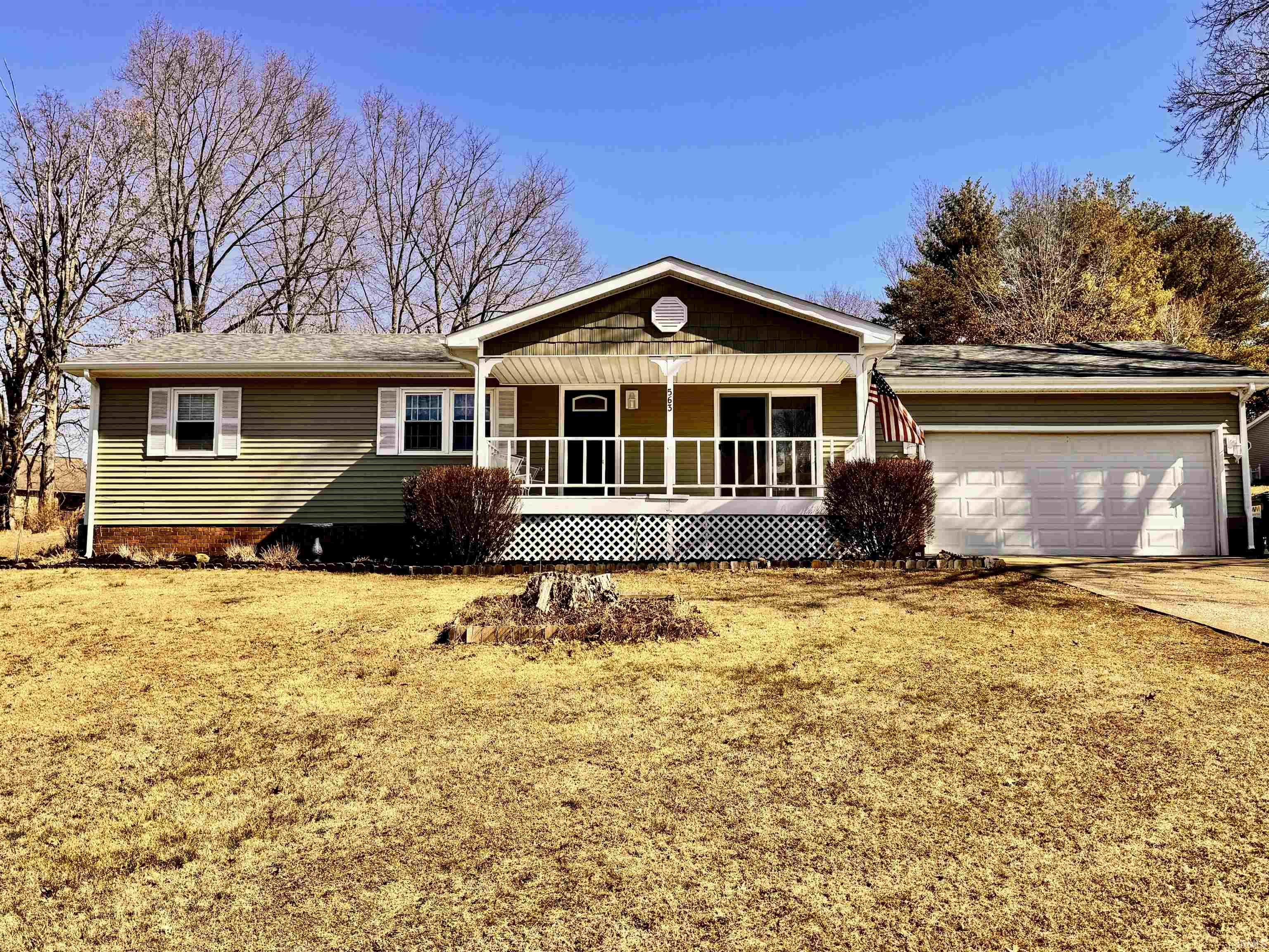Image 0: Single story home featuring a porch, a garage, concrete driveway, and a front yard, Front Of Structure Image 0: Single story home featuring a porch, a garage, concrete driveway, and a front yard, Front Of Structure