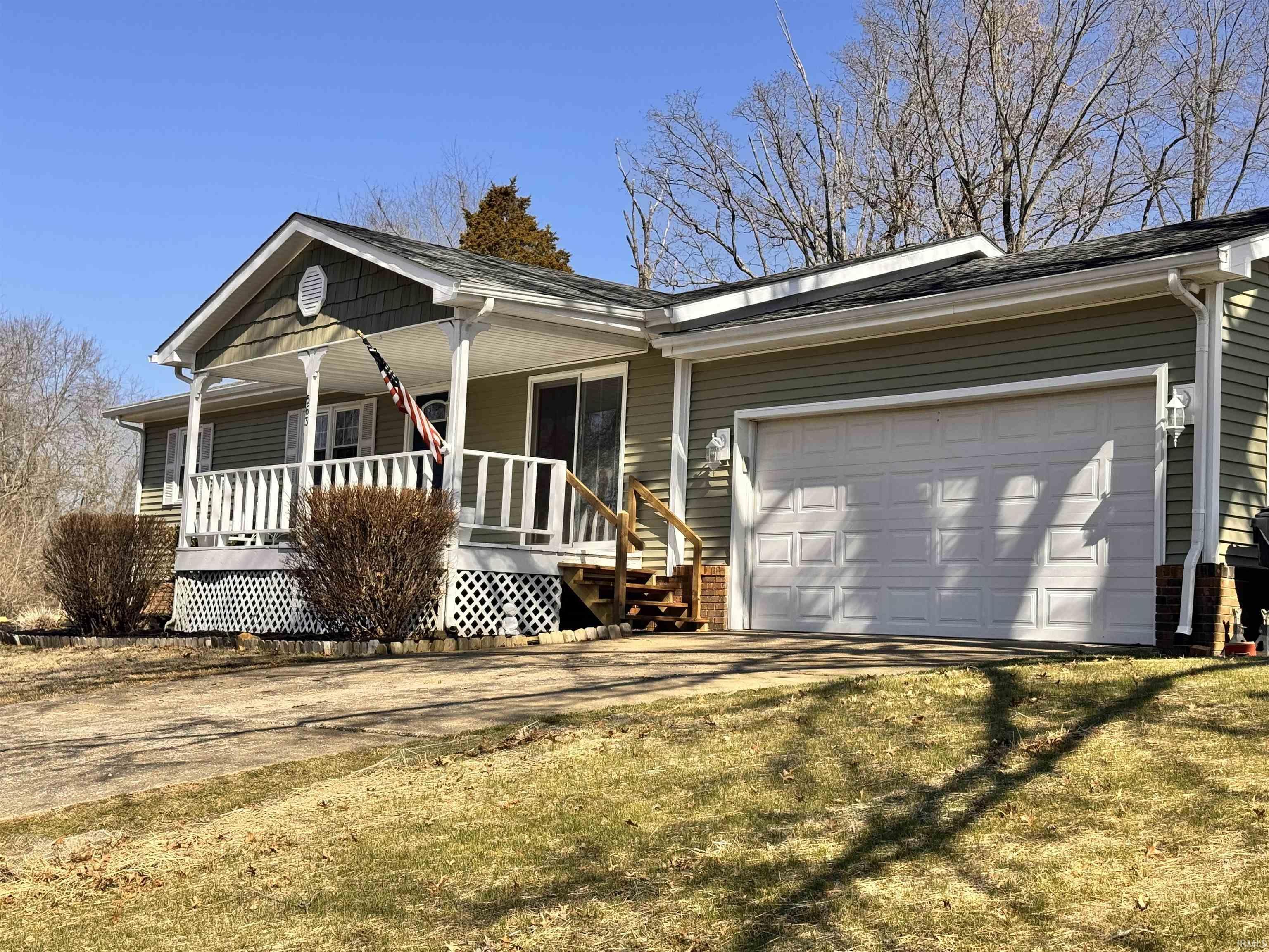 Image 1: Ranch-style house with a porch, an attached garage, and driveway, Front Of Structure Image 1: Ranch-style house with a porch, an attached garage, and driveway, Front Of Structure