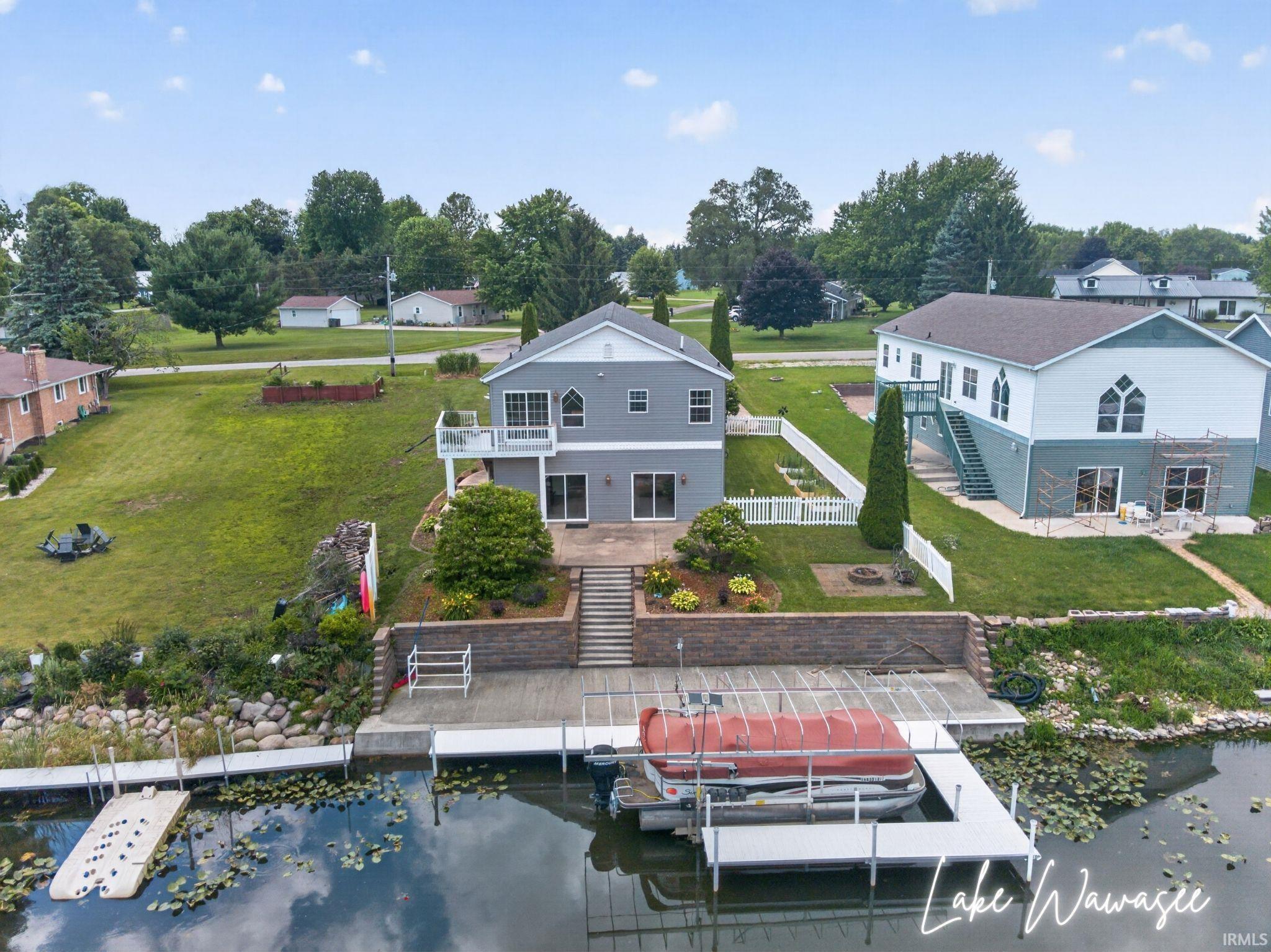 Image 3: Waterfront residence featuring a private dock with boat lift, Aerial View