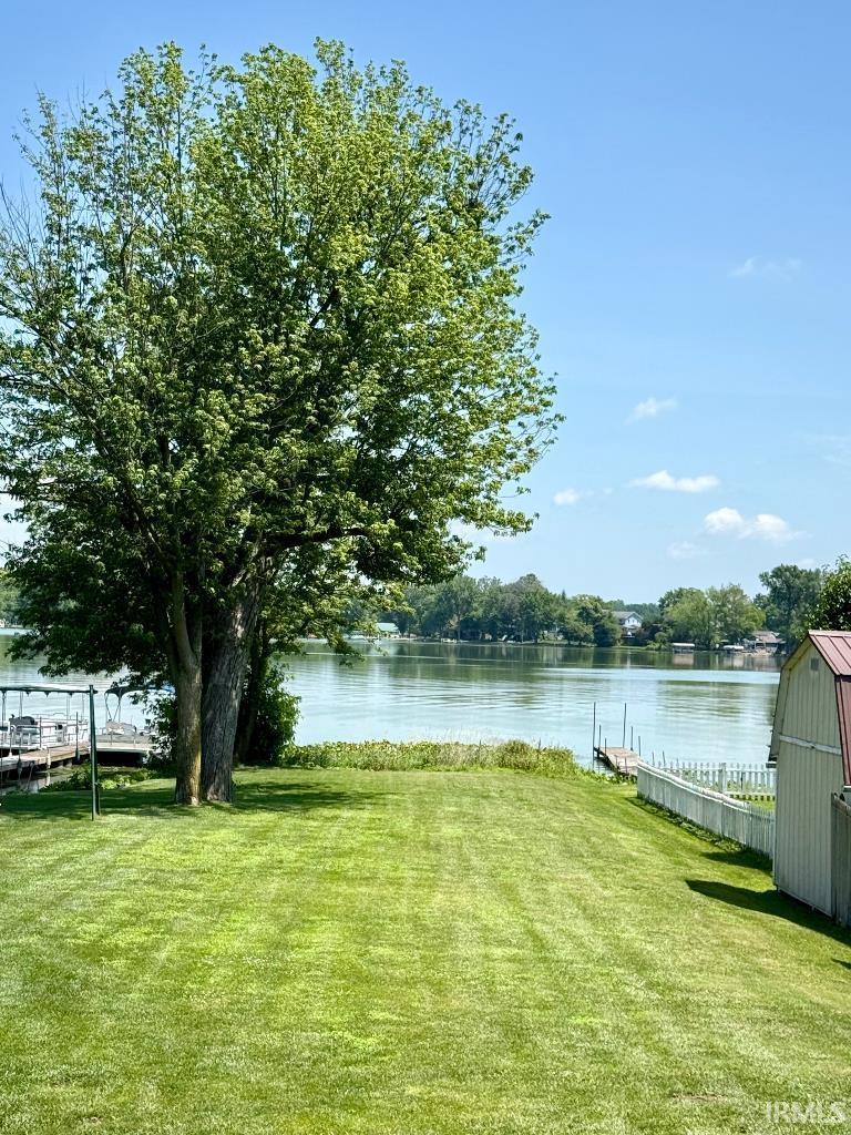 Image 1: View of green lawn with a water view, Yard Image 1: View of green lawn with a water view, Yard