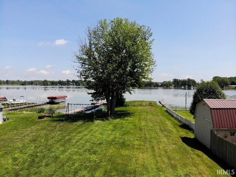 Image 3: View of yard with a boat dock and a water view, Yard Image 3: View of yard with a boat dock and a water view, Yard