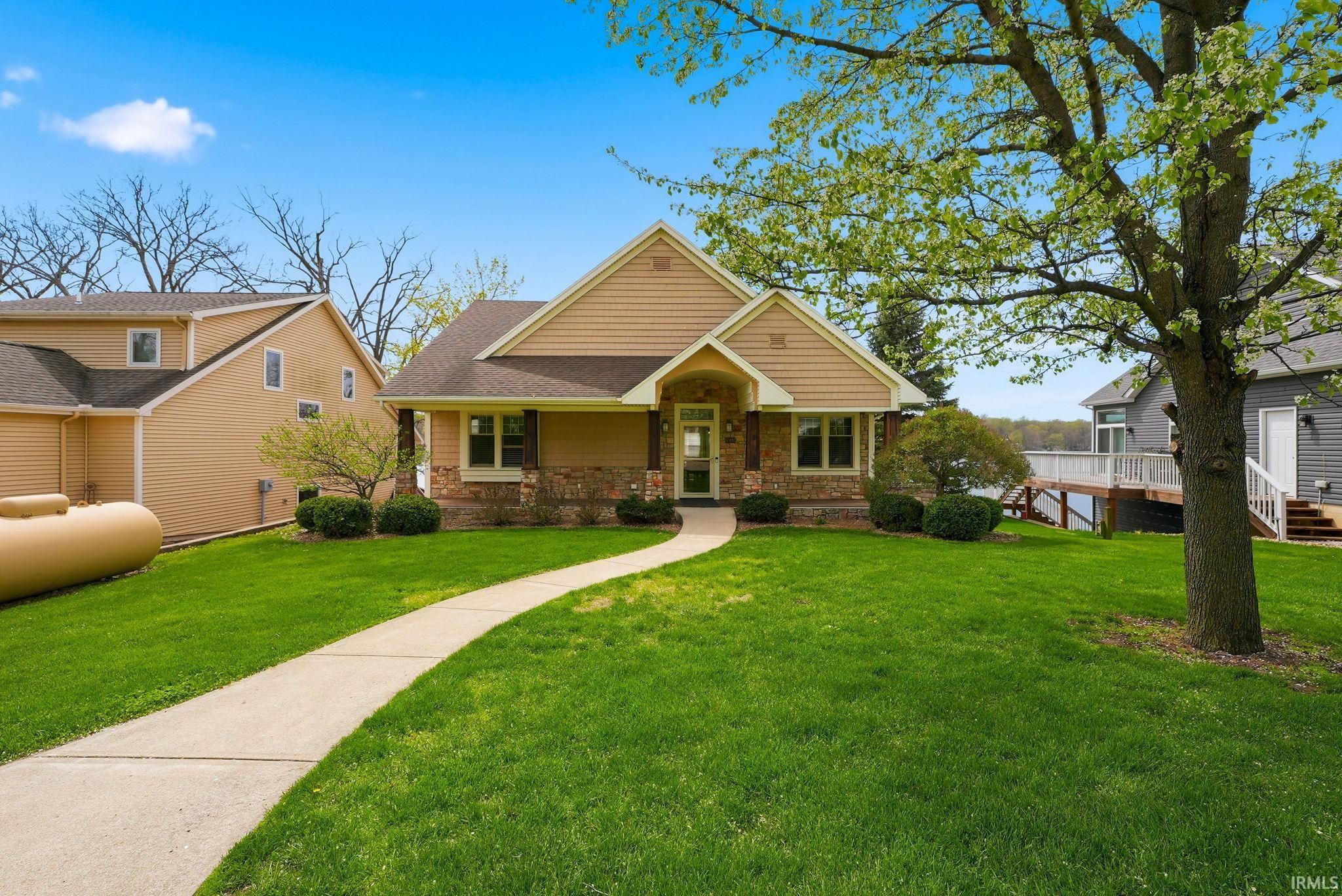Image 2: View of front of home with a front lawn and roof with shingles, Front Of Structure