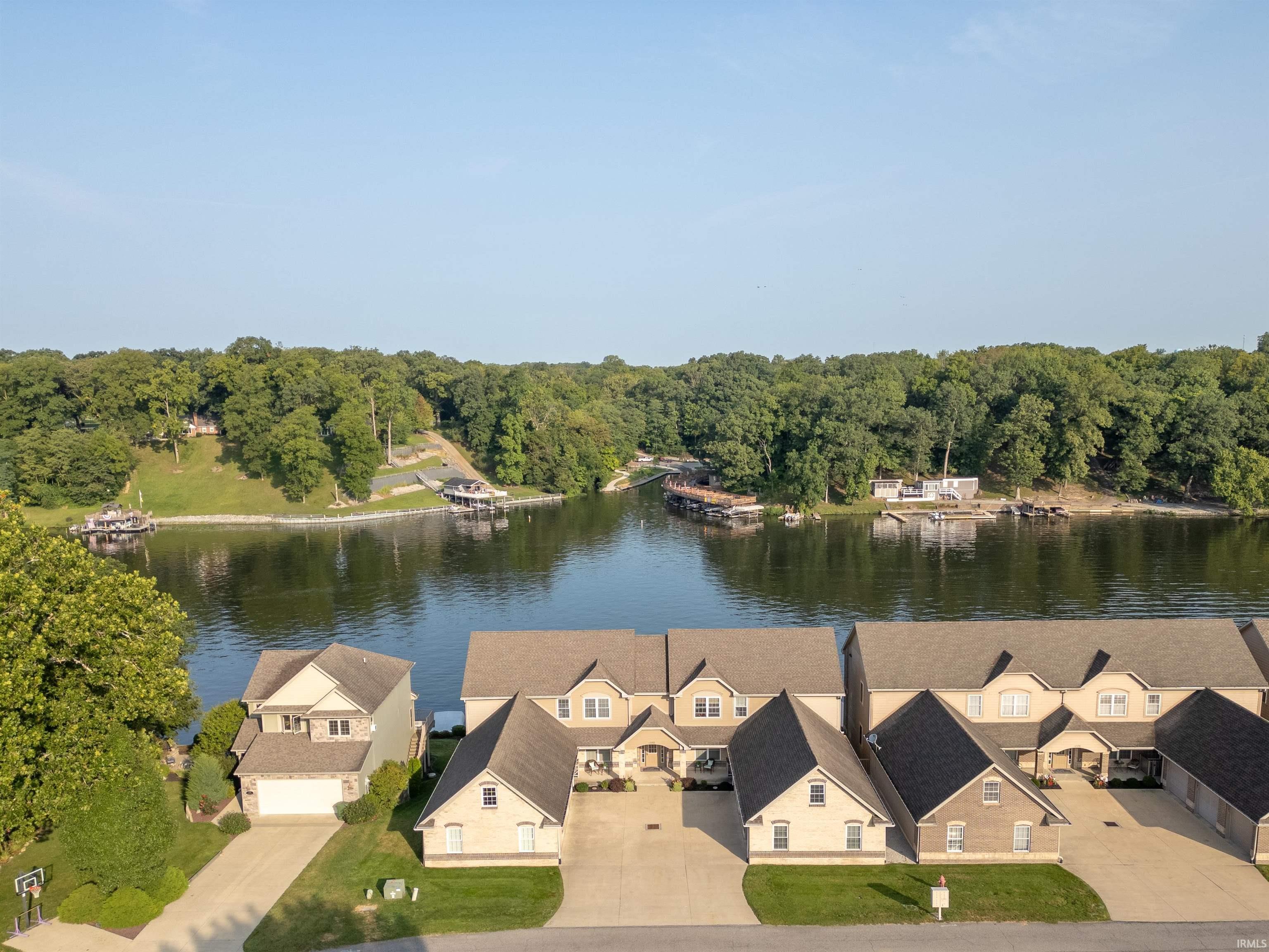 Image 0: Aerial view of residential area with a large body of water, Aerial View Image 0: Aerial view of residential area with a large body of water, Aerial View