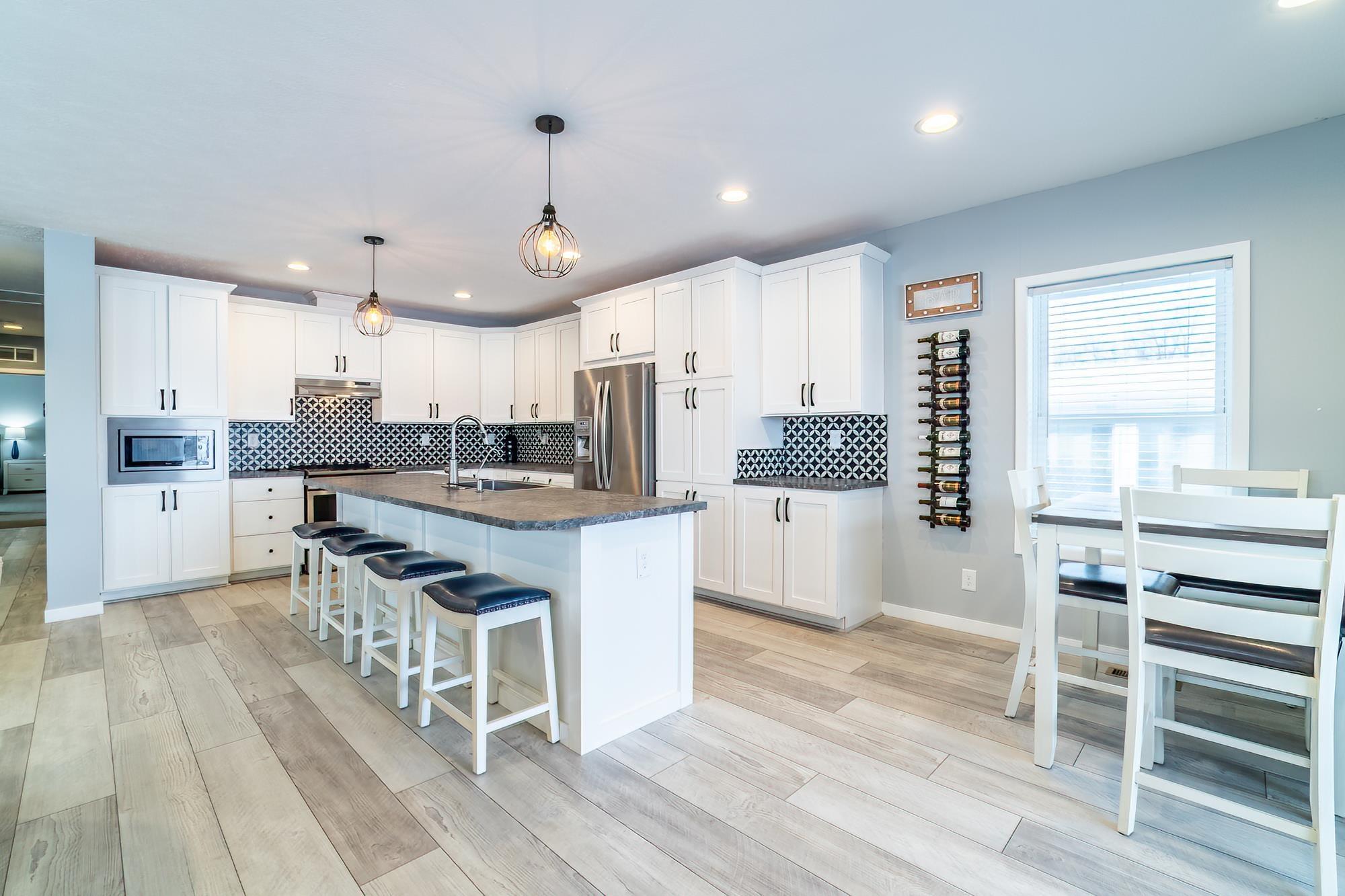 Image 3: 5110 N 450 W Lot 70, Angola, IN 46703, Kitchen Equipped with Stainless Steel Whirlpool Appliances & Farmhouse Sink