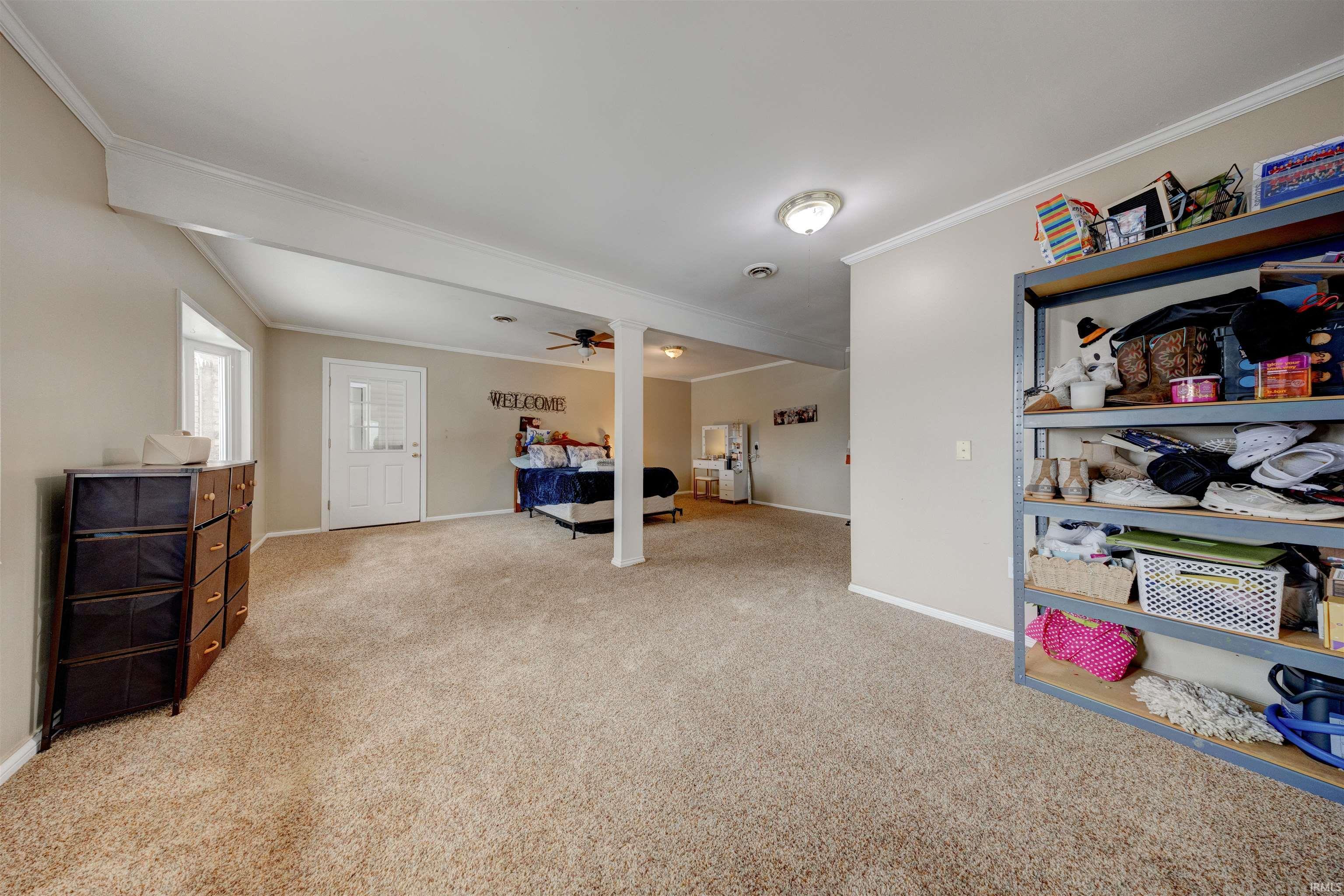 Image 3: Bedroom featuring crown molding and light colored carpet, Bedroom