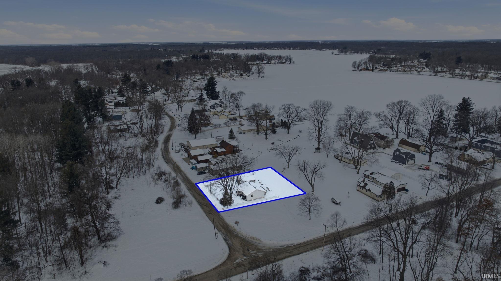 Image 3: Snowy aerial view featuring property parcel outlined, Aerial View
