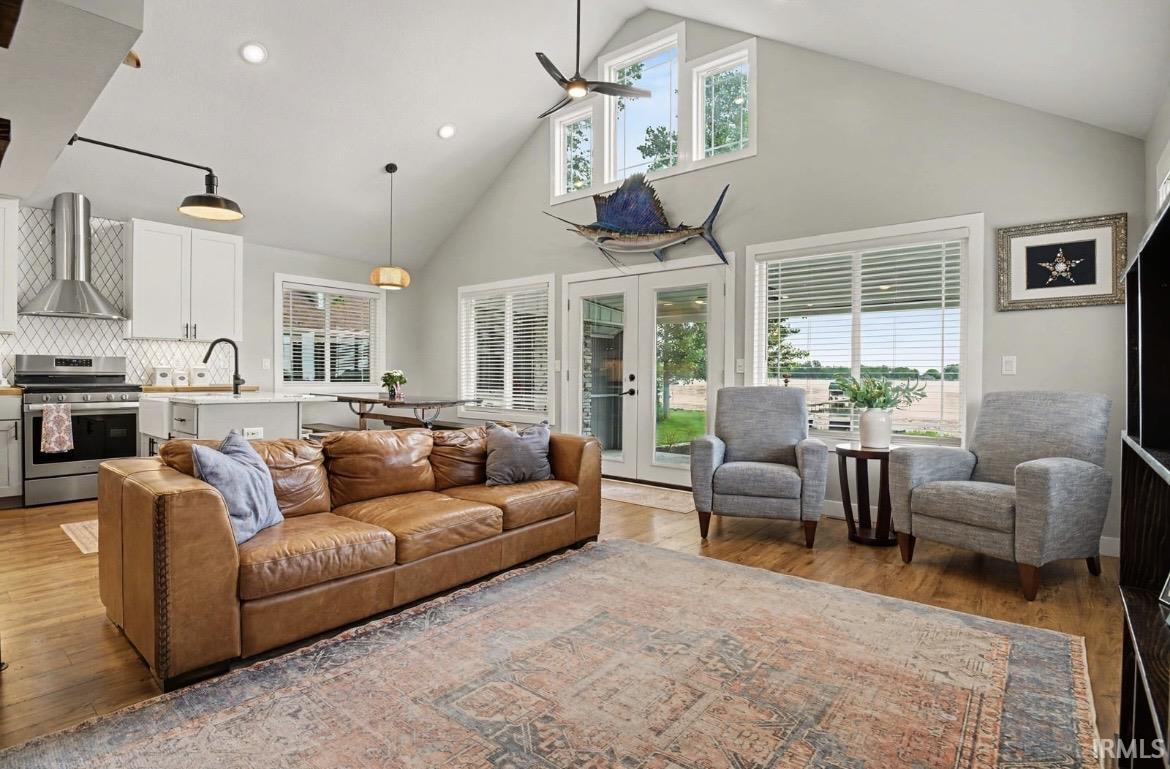 Image 3: Vaulted ceilings featuring upper transom windows and a ceiling fan, Living Room Image 3: Vaulted ceilings featuring upper transom windows and a ceiling fan, Living Room