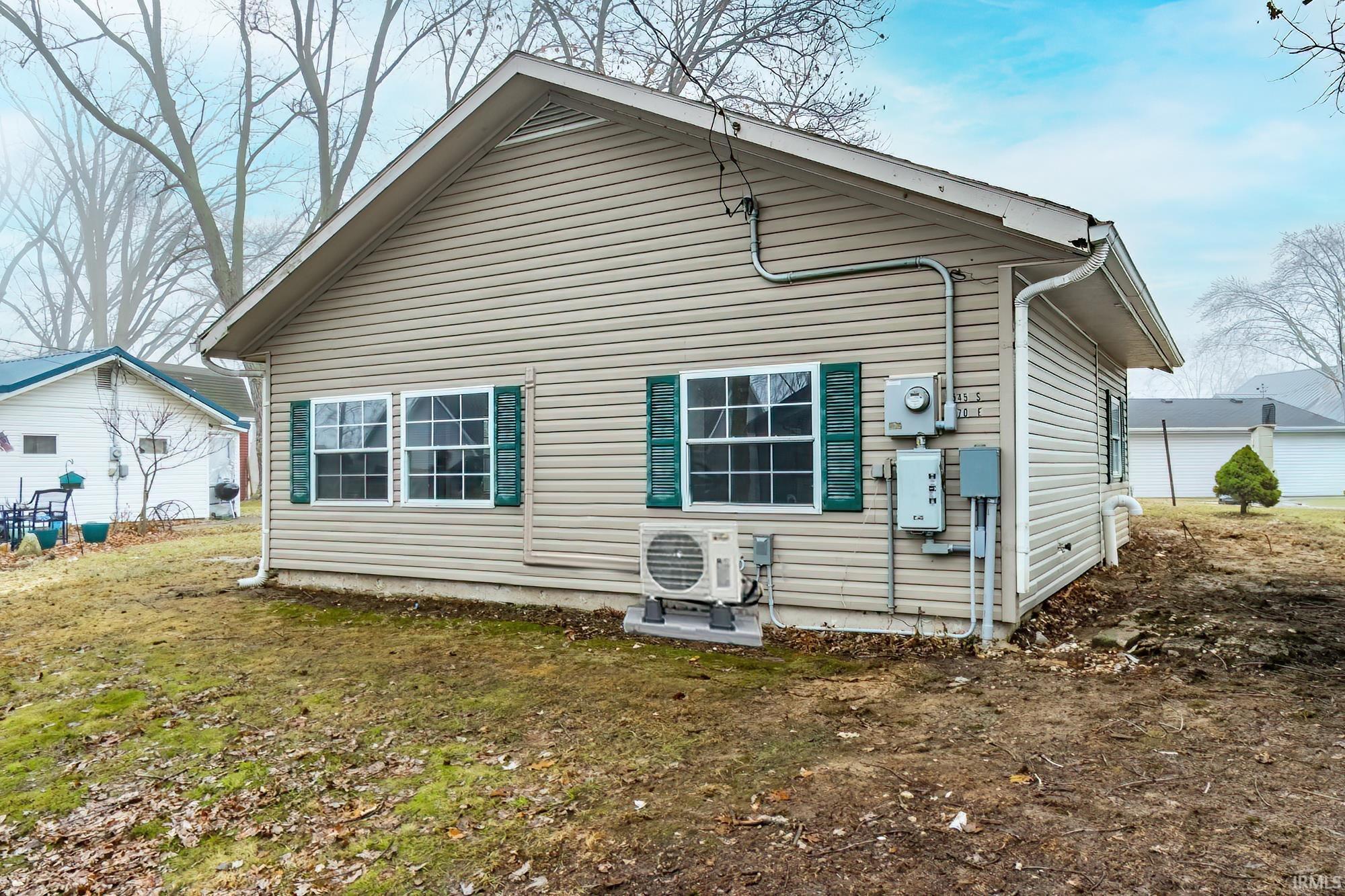 Image 1: Rear view of property featuring a yard, Back Of Structure