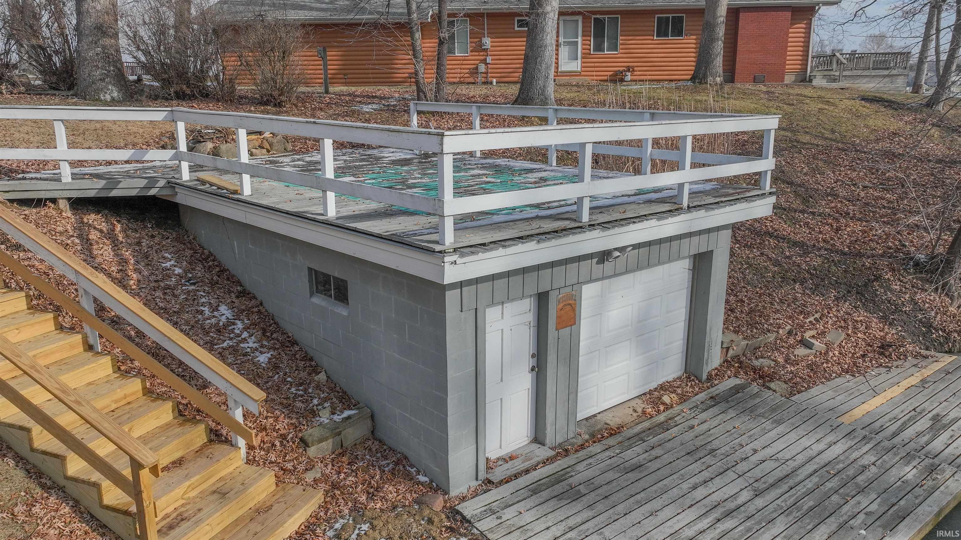 Image 2: Exterior view of stairway and faux log siding, Other Image 2: Exterior view of stairway and faux log siding, Other