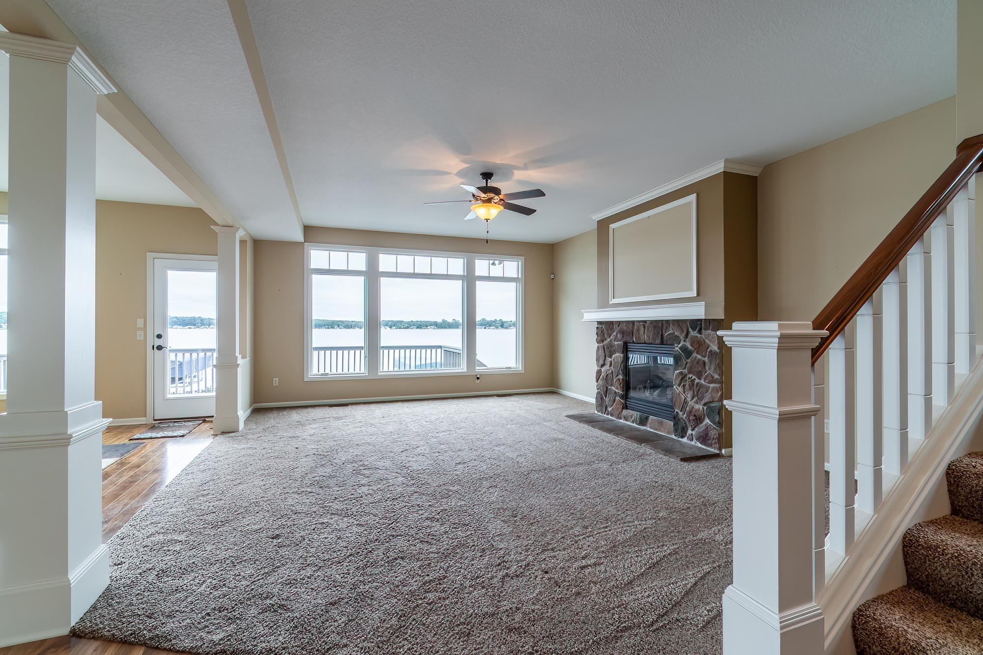 Image 3: Lake view from the front door with gas fireplace